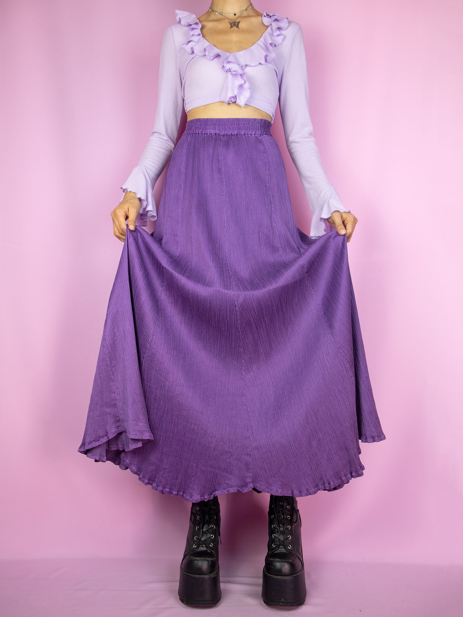 The Vintage 90s Purple Pleated Maxi Skirt is an elegant, flowy, full midi skirt with an elastic waist.