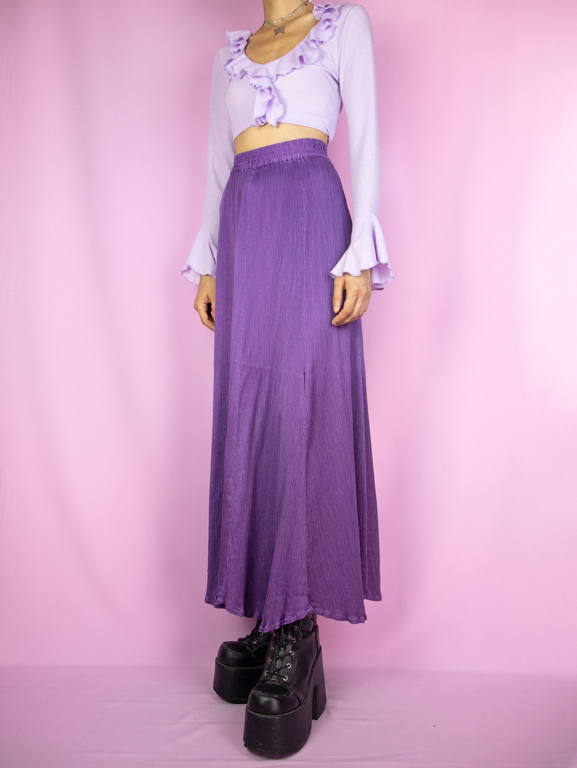 The Vintage 90s Purple Pleated Maxi Skirt is an elegant, flowy, full midi skirt with an elastic waist.