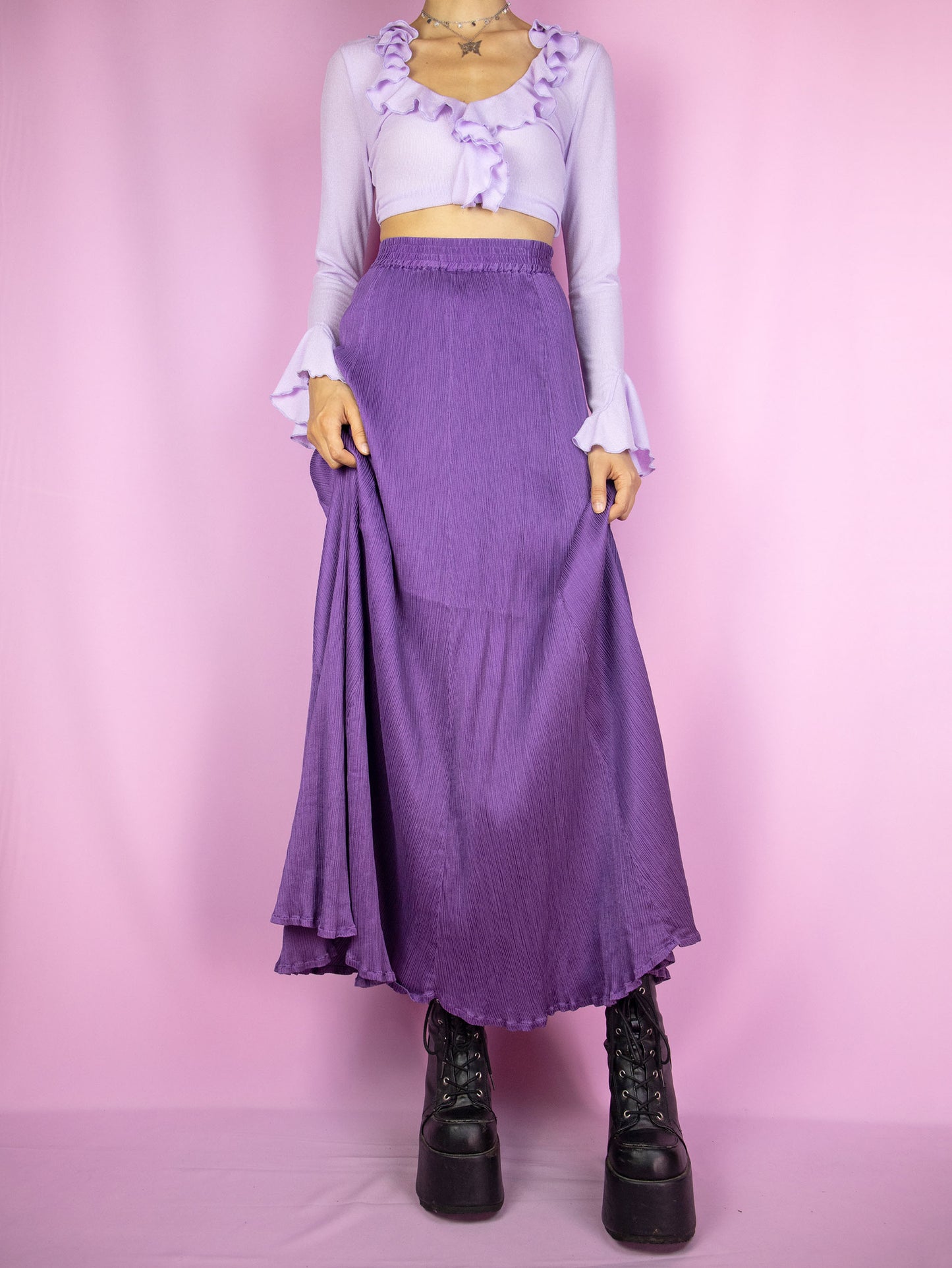 The Vintage 90s Purple Pleated Maxi Skirt is an elegant, flowy, full midi skirt with an elastic waist.