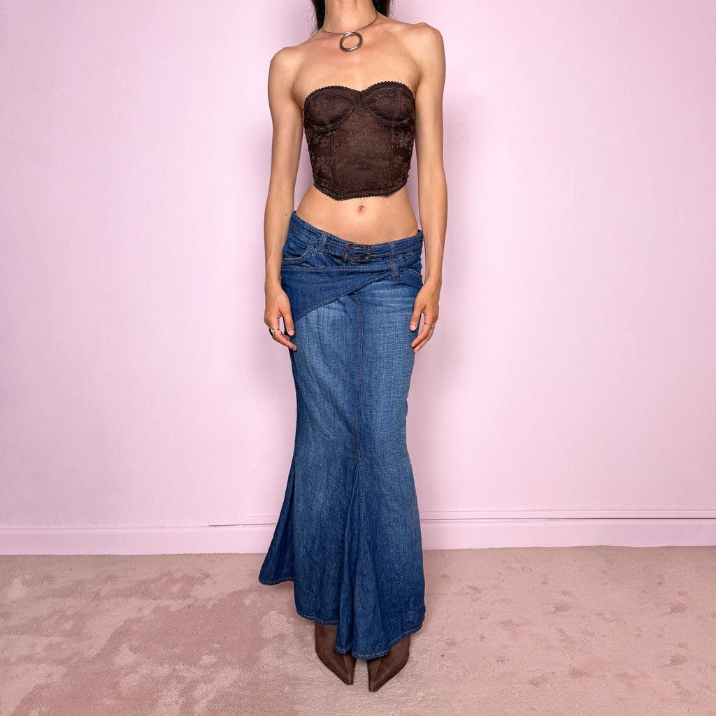 Vintage 2000s Jean’s Paul Gaultier blue denim mermaid maxi skirt made in Italy from a 68% cotton and 32% linen blend. Features a low rise, asymmetric belt detail, front zip closure, belt loops, and a dramatic flared mermaid godet-style hem. Designed with no stretch for a sculpted silhouette. A rare Y2K designer piece. Excellent vintage condition.
