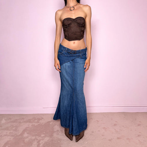 Vintage 2000s Jean’s Paul Gaultier blue denim mermaid maxi skirt made in Italy from a 68% cotton and 32% linen blend. Features a low rise, asymmetric belt detail, front zip closure, belt loops, and a dramatic flared mermaid godet-style hem. Designed with no stretch for a sculpted silhouette. A rare Y2K designer piece. Excellent vintage condition.