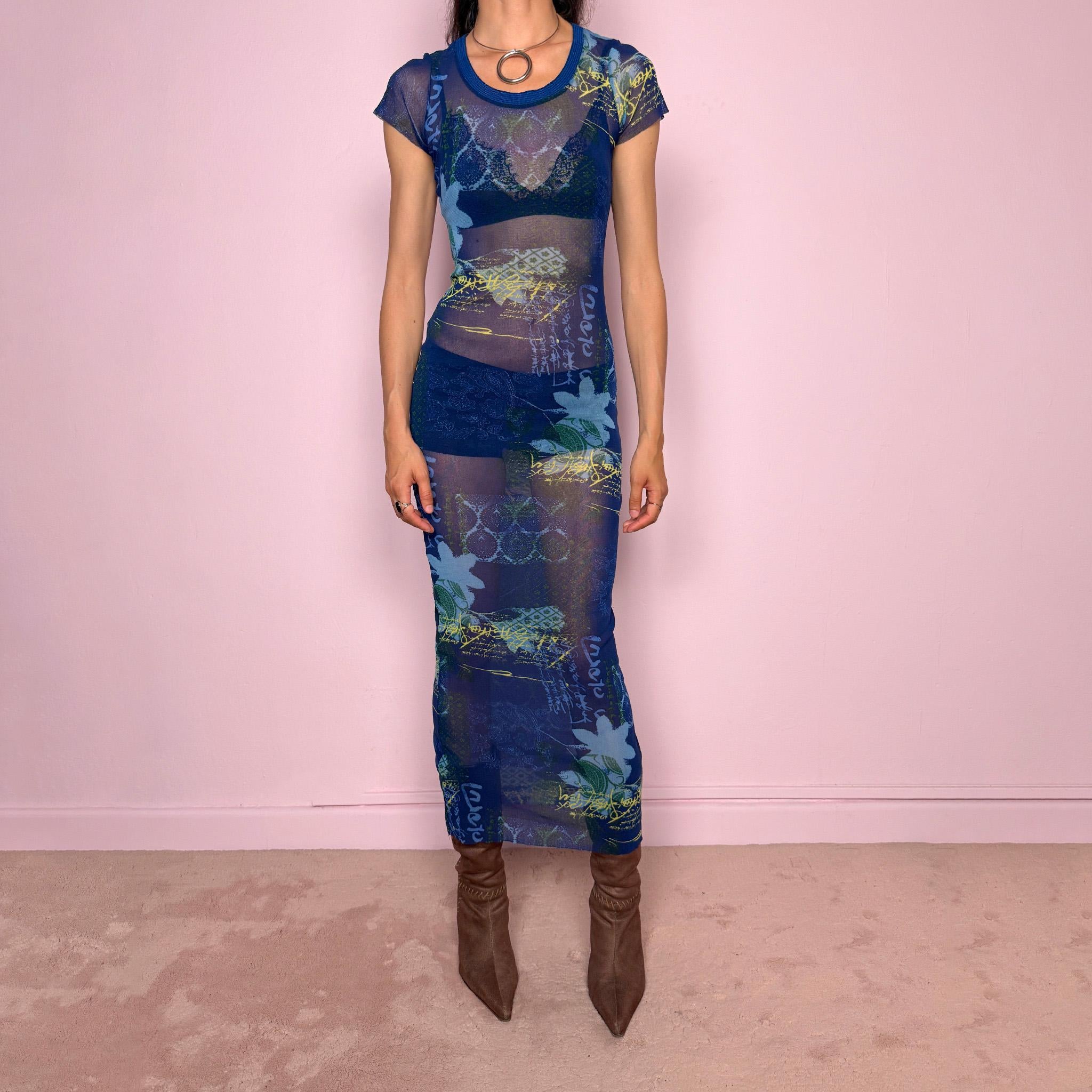 Vintage 2000s Kenzo Jeans sheer mesh maxi dress in a striking dark blue abstract patchwork print with floral and graphic details throughout. Designed in a fitted long silhouette with short sleeves, a round neckline, and lightweight semi-sheer fabric. A bold 90s/early Y2K designer piece with a futuristic avant-garde aesthetic, perfect for an editorial look.