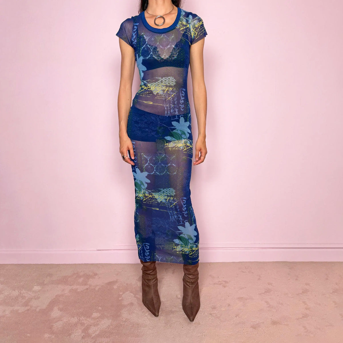 Vintage 2000s Kenzo Jeans sheer mesh maxi dress in a striking dark blue abstract patchwork print with floral and graphic details throughout. Designed in a fitted long silhouette with short sleeves, a round neckline, and lightweight semi-sheer fabric. A bold designer piece with a futuristic avant-garde aesthetic, perfect for an editorial look. Composition label is missing, so the exact fabric is unknown. Great vintage condition, with minor signs of wear to the mesh, including some light rubbing/pilling in a 