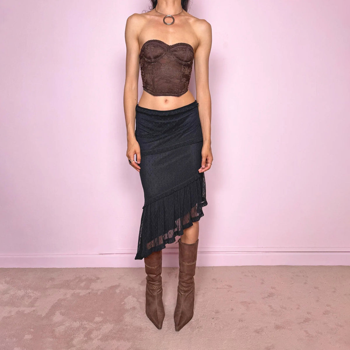Vintage 2000s Moschino Jeans black lace asymmetric midi skirt made in Italy from a stretchy polyamide fabric. Features a low-rise, soft stretch waistband without elastic, delicate ruffle trim, layered asymmetric panels, and a sheer lace pleated hem. A dark romantic Y2K designer piece, perfect for elevated evening looks. Excellent vintage condition.