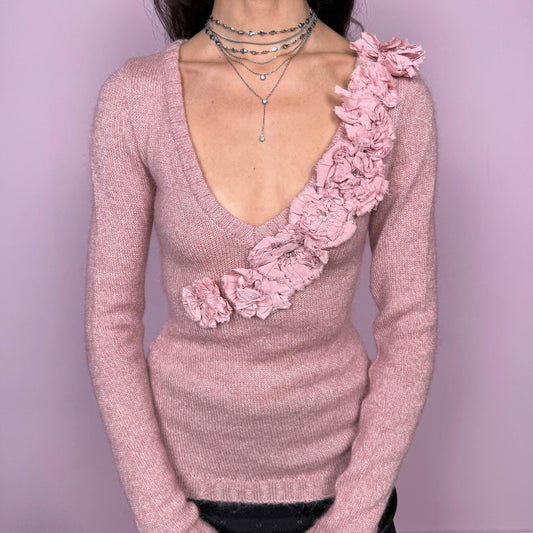 Vintage early 2000s romantic feminine sweater by Moschino Cheap and Chic, Italian designer. Deep V-neck with long sleeves and a fitted silhouette. Features a dramatic cascading rosette appliqué across the front, creating a striking, unique avant-garde statement. Perfect for coquette or balletcore-inspired winter styling. Made in Italy from 100% virgin wool. Excellent vintage condition.