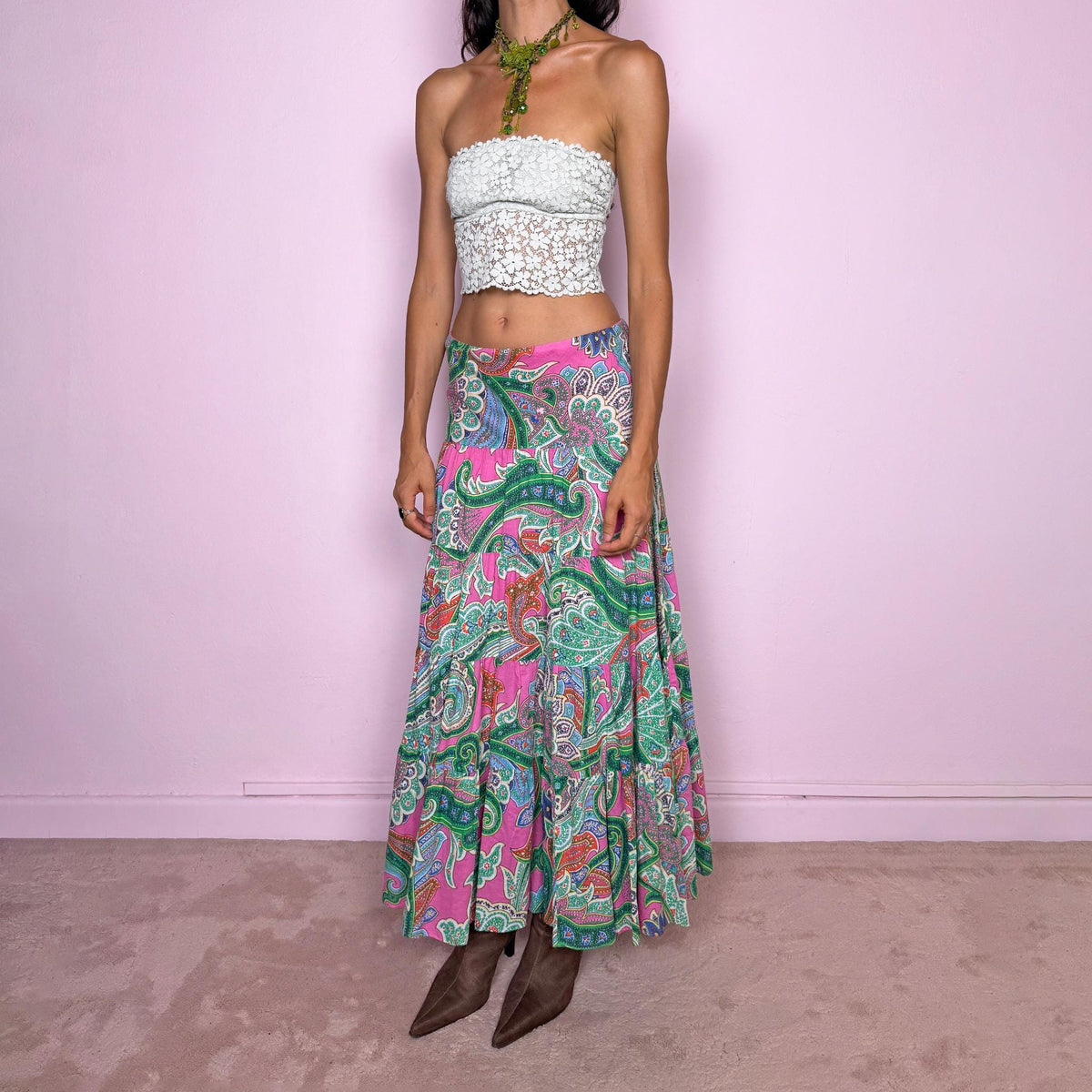 Vintage 2000s bohemian paisley maxi skirt, crafted from 100% cotton with a 100% cotton lining. Features a vibrant all-over paisley print in pink, green, blue, and orange tones, a softly flared tiered silhouette, and an elasticated waist. Can be worn mid- to low-rise for size S. By American brand Lauren Ralph Lauren. Excellent vintage condition.