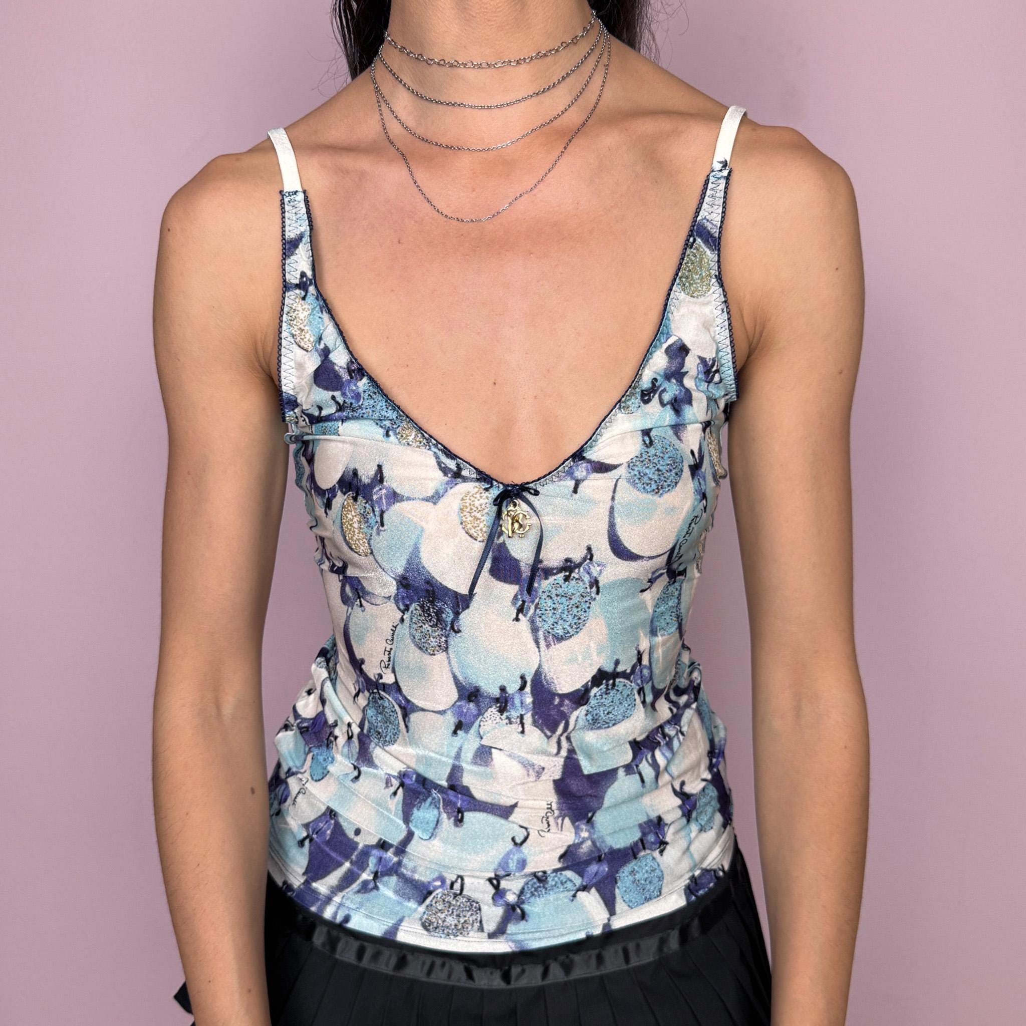 Vintage 2000s Roberto Cavalli Underwear cami top in a delicate blue and white abstract print with a fitted stretchy silhouette, contrast trims, and a signature gold-tone Cavalli charm at the front. Made from a 75% polyamide and 25% elastane blend, with a flattering V neckline and thin straps. A sensual, dreamy Y2K piece for lingerie-as-outerwear and refreshing summer looks. Excellent vintage condition.