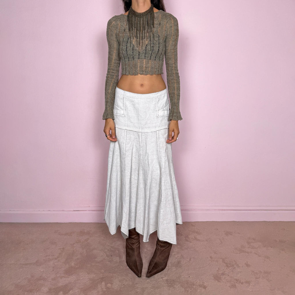 Vintage 2000s greyish-white maxi skirt by Belgian label Sarah Pacini, made in Italy from a non-stretch ramie blend. Features a fitted upper section, contrast topstitching, a back zip, a paneled flared silhouette, and an irregular handkerchief hem. Softly distressed, washed finish with a painted effect. Can be worn mid-rise for size S or lower on the waist for size XS. Excellent vintage condition.