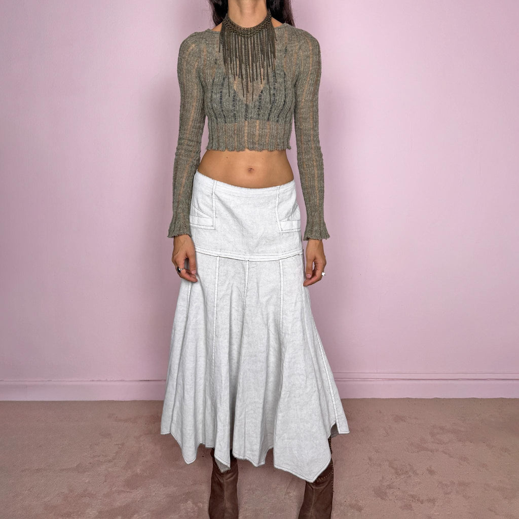Vintage 2000s greyish-white maxi skirt by Belgian label Sarah Pacini, made in Italy from a non-stretch ramie blend. Features a fitted upper section, contrast topstitching, a back zip, a paneled flared silhouette, and an irregular handkerchief hem. Softly distressed, washed finish with a painted effect. Can be worn mid-rise for size S or lower on the waist for size XS. Excellent vintage condition.