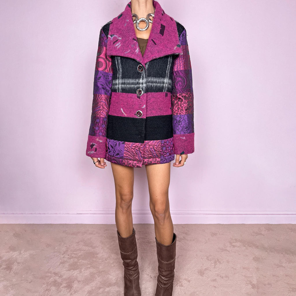 Vintage 2000s colorful wool-blend jacket by Italian label Save the Queen, made in Italy from 60% wool and 40% polyester. Features a fitted, tailored silhouette with an oversized magenta collar, statement button-front closure, and a bold patchwork-inspired mix of black, fuchsia, and purple panels with abstract, animal, and graphic motifs. Perfect for playful avant-garde maximalist styling, statement winter looks, and colorful outfits. Excellent vintage condition.