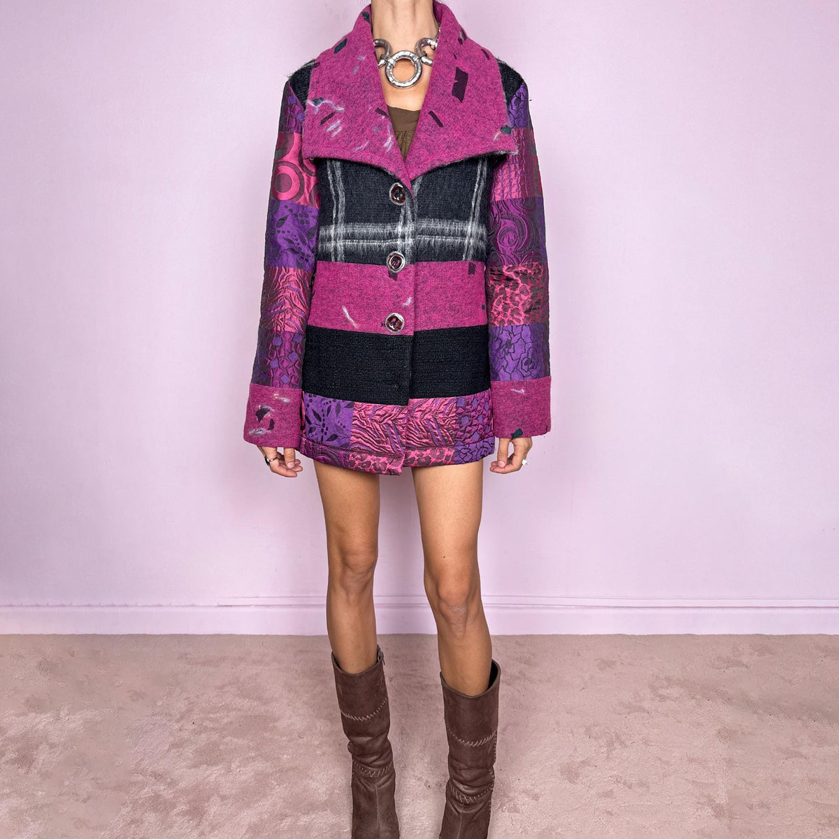 Vintage 2000s colorful wool-blend jacket by Italian label Save the Queen, made in Italy from 60% wool and 40% polyester. Features a fitted, tailored silhouette with an oversized magenta collar, statement button-front closure, and a bold patchwork-inspired mix of black, fuchsia, and purple panels with abstract, animal, and graphic motifs. Perfect for playful avant-garde maximalist styling, statement winter looks, and colorful outfits. Excellent vintage condition.