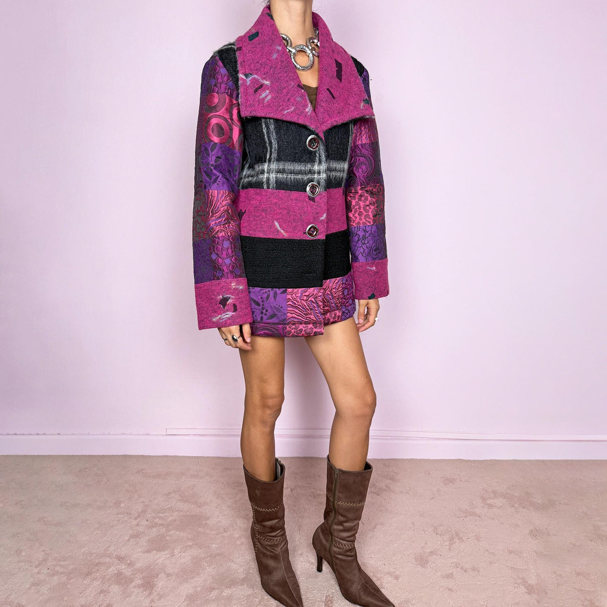 Vintage 2000s colorful wool-blend jacket by Italian label Save the Queen, made in Italy from 60% wool and 40% polyester. Features a fitted, tailored silhouette with an oversized magenta collar, statement button-front closure, and a bold patchwork-inspired mix of black, fuchsia, and purple panels with abstract, animal, and graphic motifs. Perfect for playful avant-garde maximalist styling, statement winter looks, and colorful outfits. Excellent vintage condition.