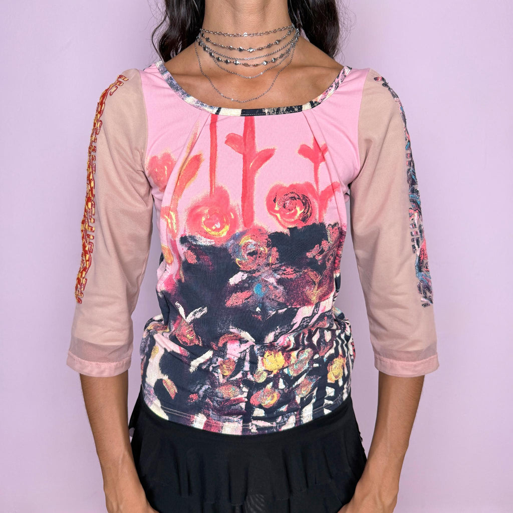 Vintage 2000s art-print top by Italian label Save the Queen, made in Italy. Featuring a fitted, stretchy silhouette with a painterly floral graphic in pink, red, black, and cream tones, semi-sheer 3/4 sleeves, and contrasting decorative detailing along the sleeves. The composition label is faded and no longer legible, so the exact fabric content is unknown. Excellent vintage condition.