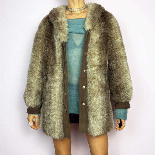 The Vintage 90s Plush Faux Fur Coat is a statement outerwear piece exuding warmth and glamour. This coat features a plush faux fur texture in earthy tones, creating a cozy look. Designed with a snap button-front closure, pockets and long sleeves, this coat is perfect for chilly days and for layering over casual or dressy outfits.