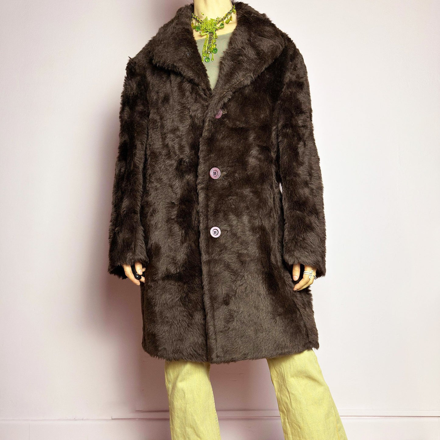 The Vintage 90s Faux Fur Brown Coat is a plush and cozy statement piece with a classic silhouette. Featuring deep chocolate brown faux fur fabric, a wide notched collar, bold contrasting buttons and pockets. Perfect for vintage streetwear, or cozy casual winter looks. A statement 90s archive coat with timeless appeal. Made from an acrylic faux fur blend. Excellent vintage condition.