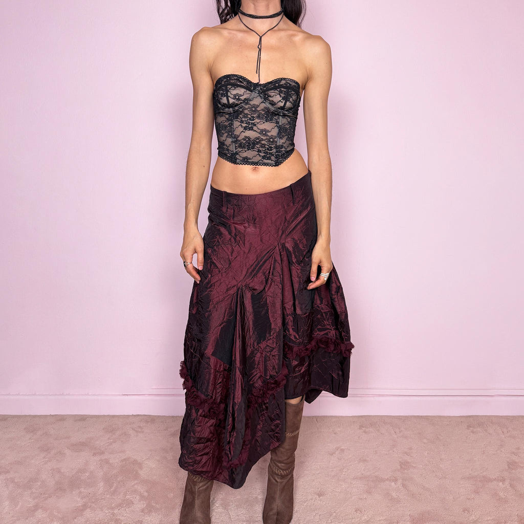 Vintage 2000s burgundy iridescent midi skirt with an avant garde experimental feel. Features a crinkle texture, asymmetric hem, and sculptural draped panels with rosette appliqué details. Voluminous and artistic silhouette with back zip closure, no stretch. Can be worn high waisted for size M or lower for XS/S. Made from polyester. Rare archive piece. Excellent vintage condition.