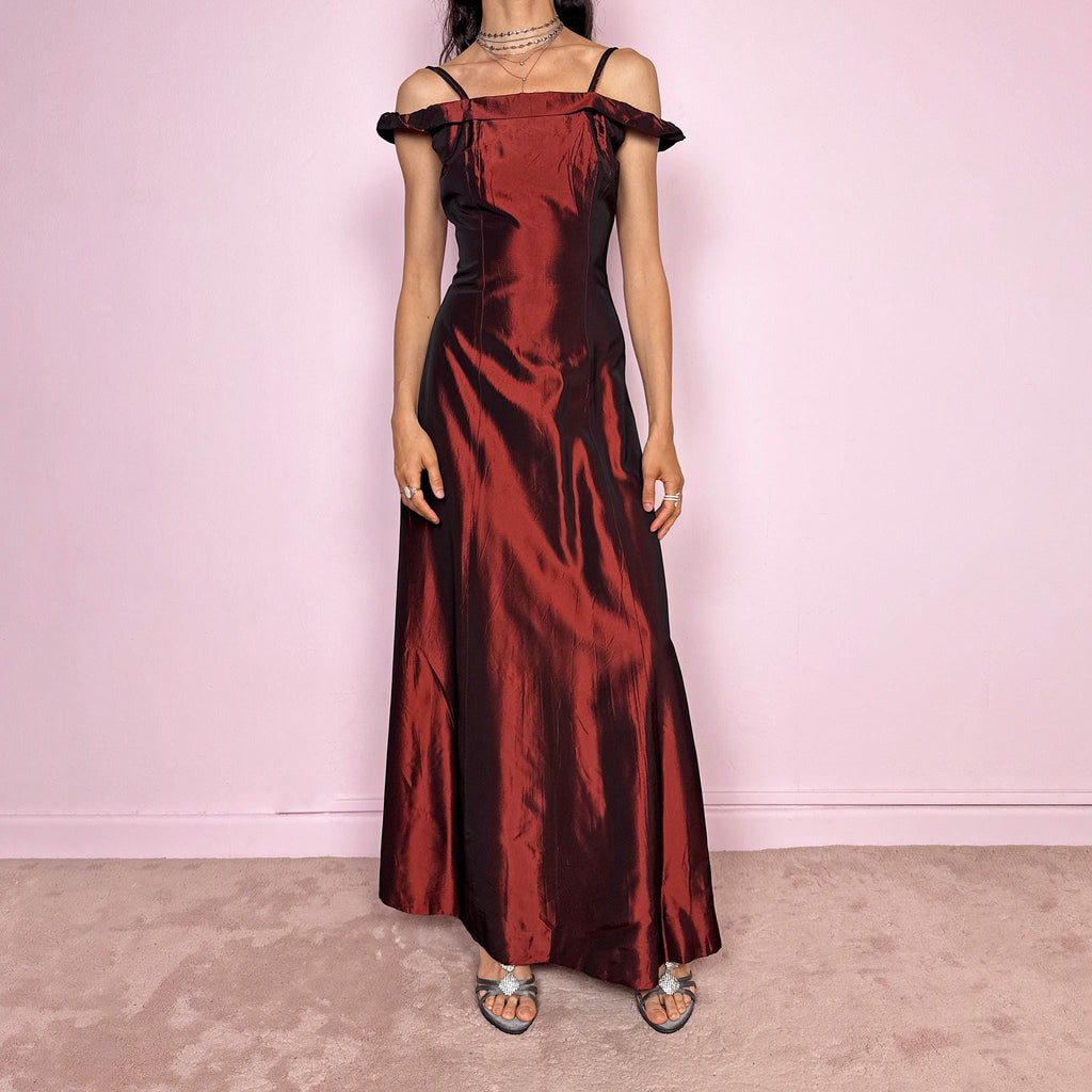 Vintage 2000s statement evening gown in rich burgundy iridescent fabric with a sculpted off shoulder neckline and delicate straps. Elegant body-skimming silhouette with full length maxi cut, subtle flare hem and back zip closure. Dramatic old Hollywood energy, perfect for formal events, editorials or modern occasionwear. Non-stretch fabric. Excellent vintage condition.