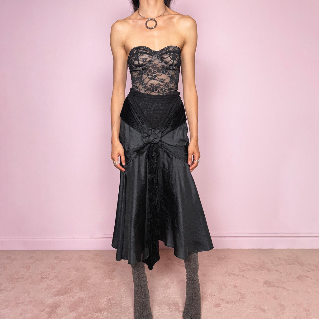 Vintage 2000s rare statement black avant-garde midi skirt made in France from 100% viscose. High-waisted fit with back zip closure, elasticated waist, dramatic flared silhouette, asymmetric draped construction, and velvet-textured front details. Dark, elegant, and sculptural, ideal for a formal party with a witchy twist. Can be worn high waisted for size S and XS. Excellent vintage condition.