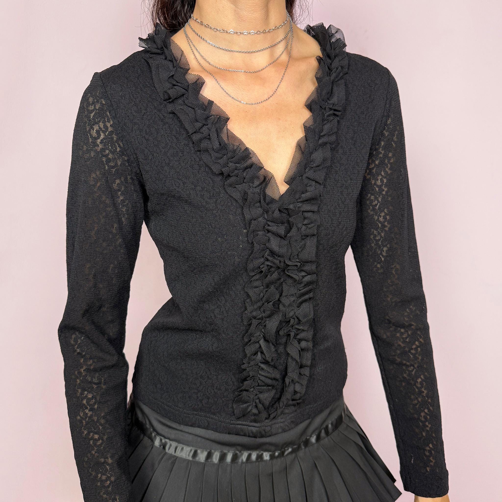 Vintage 2000s black stretch lace mesh top, designed with a fitted silhouette, sheer floral lace texture, long sleeves, and dramatic ruffle detailing through the deep V neckline. The layered mesh ruffles add a dark romantic, gothic, and feminine feel ideal for evening outfits. Made from 100% polyamide. Excellent vintage condition.