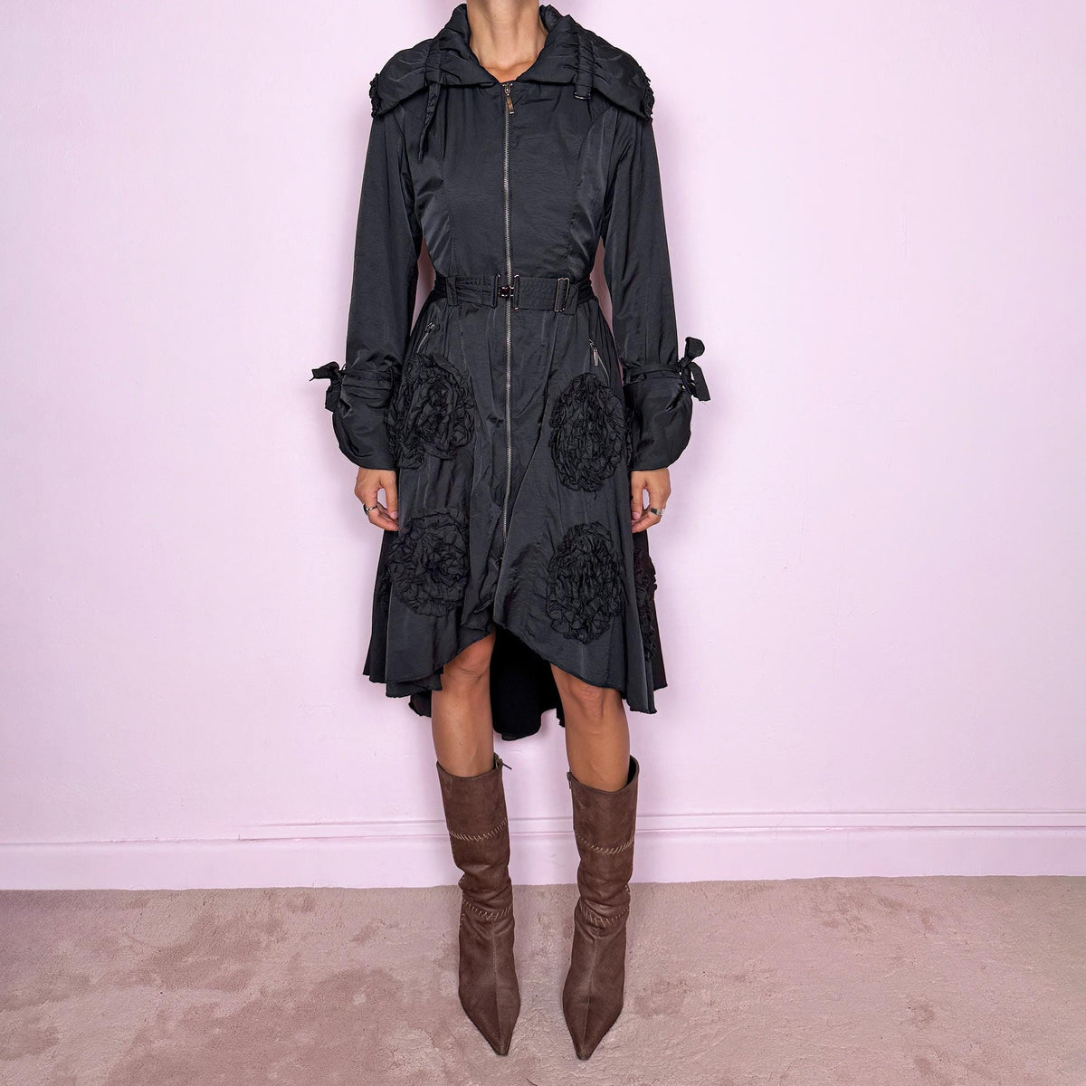 Vintage 2000s black longline coat featuring an oversized gathered collar, removable waist belt, full front zip closure, zip pockets, tied cuffs, and oversized textured rosette appliqués throughout. The belt allows it to be cinched at the waist. Perfect for dark avant-garde styling. Crafted from a 60% acrylic and 40% cotton blend with a soft fleece-like interior. Great vintage condition overall, with the pull tab missing from one of the pocket zippers, as shown in the last picture.