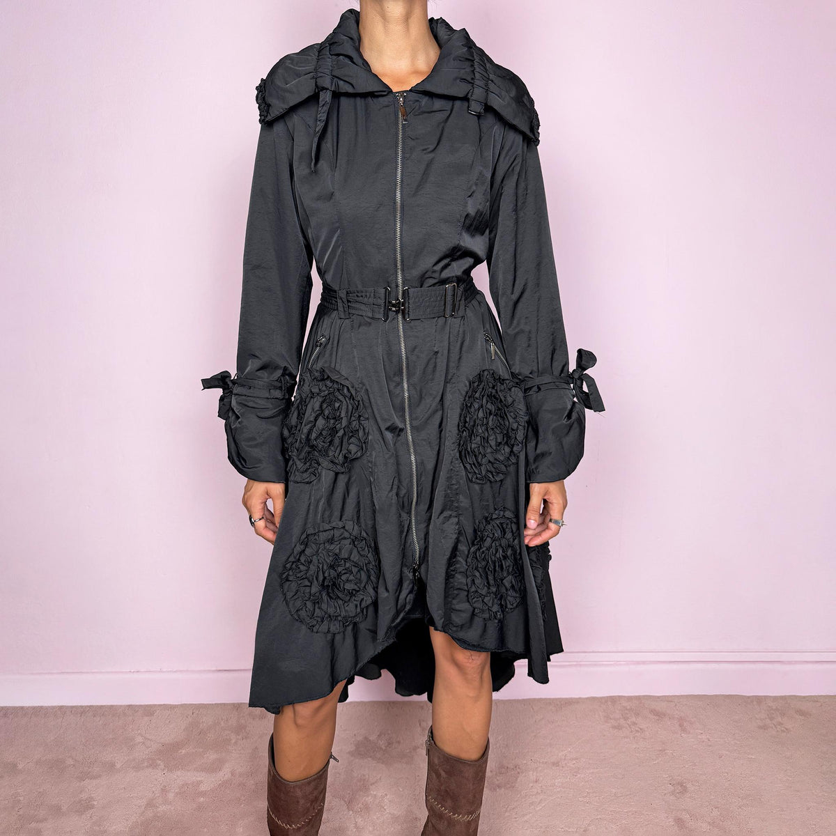 Vintage 2000s black longline coat featuring an oversized gathered collar, removable waist belt, full front zip closure, zip pockets, tied cuffs, and oversized textured rosette appliqués throughout. The belt allows it to be cinched at the waist. Perfect for dark avant-garde styling. Crafted from a 60% acrylic and 40% cotton blend with a soft fleece-like interior. Great vintage condition overall, with the pull tab missing from one of the pocket zippers, as shown in the last picture.
