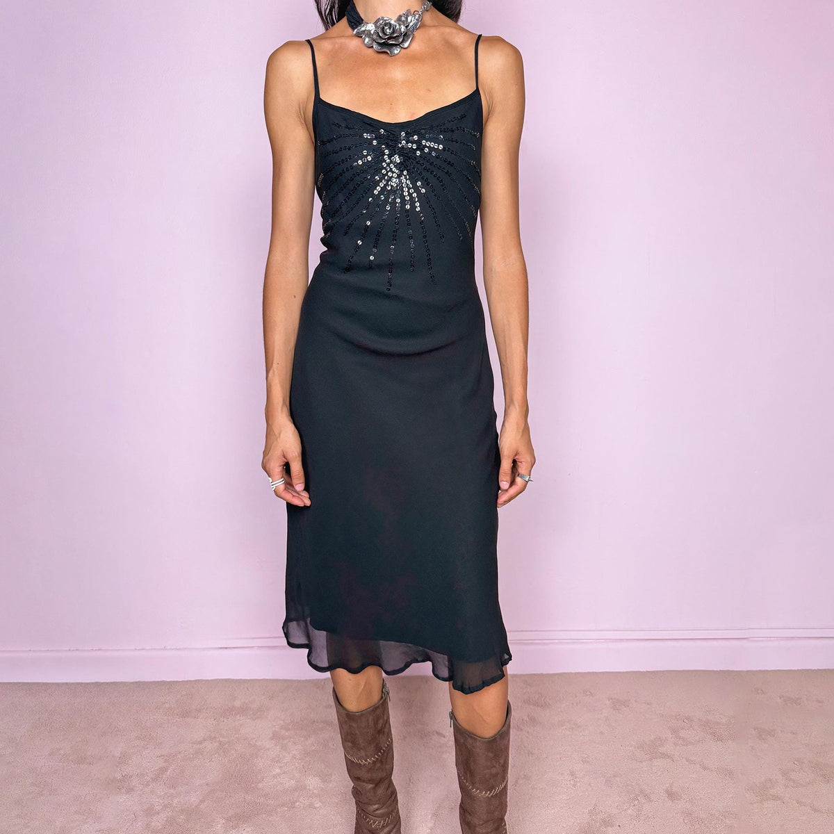 Vintage 2000s black silk midi dress crafted from 100% silk. Featuring a fluid slip-style silhouette with adjustable spaghetti straps and black sequin embellishment across the bust. Lightweight and non-stretch, with a semi-sheer outer layer and black lining underneath. Perfect for minimal evening styling. Excellent vintage condition.