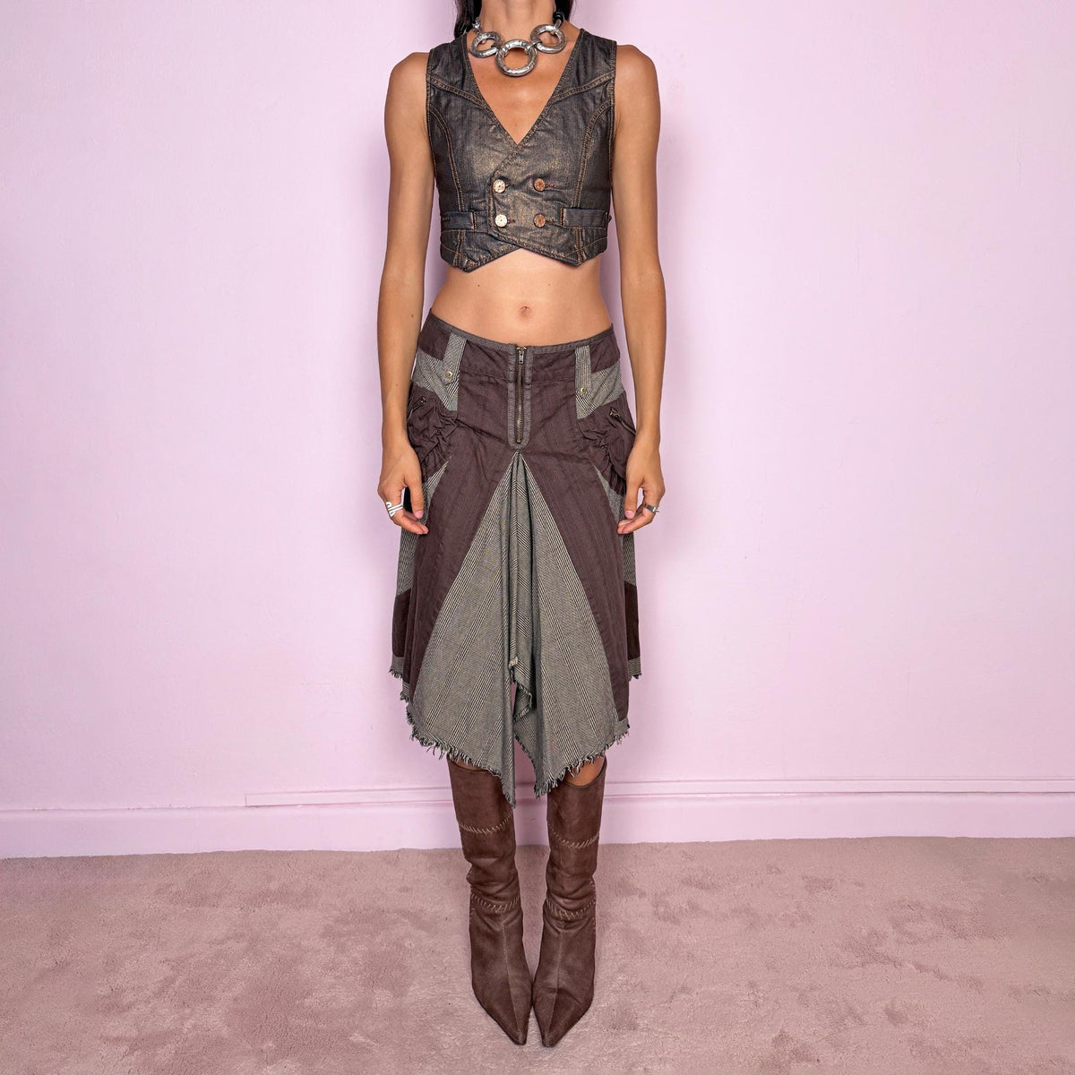 Vintage 2000s deconstructed midi skirt featuring an exposed front zip closure, contrast plaid panel inserts, utility-style pocket detailing, and dramatic asymmetric godet panels with raw frayed edges. The mix of brown and beige tones, visible construction details, and irregular hem give it a distinctly Y2K avant-garde, utilitarian aesthetic. Non-stretch. Can be worn mid-rise for size M or lower on the waist for size S. From a Dutch brand, made from 100% cotton. Excellent vintage condition.