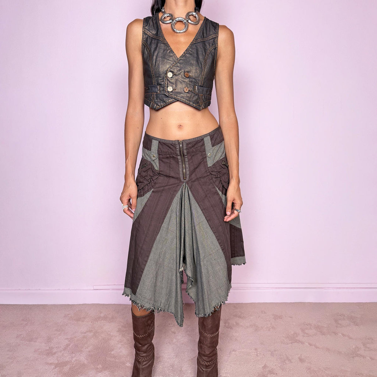 Vintage 2000s deconstructed midi skirt featuring an exposed front zip closure, contrast plaid panel inserts, utility-style pocket detailing, and dramatic asymmetric godet panels with raw frayed edges. The mix of brown and beige tones, visible construction details, and irregular hem give it a distinctly Y2K avant-garde, utilitarian aesthetic. Non-stretch. Can be worn mid-rise for size M or lower on the waist for size S. From a Dutch brand, made from 100% cotton. Excellent vintage condition.