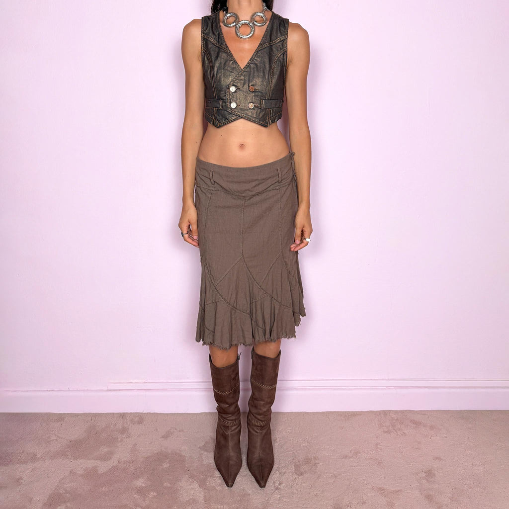Vintage 2000s brown midi skirt, made in Italy from a structured 95% cotton and 5% elastane blend. Featuring exposed seam detailing, sculptural panel construction, and a flared asymmetric hem finished with raw, frayed edges. Side zip closure. Non-stretch. The earthy, deconstructed construction gives it a rustic, avant-garde aesthetic. Can be worn high-waisted for size M or mid- to lower-rise for sizes S and XS. Excellent vintage condition.