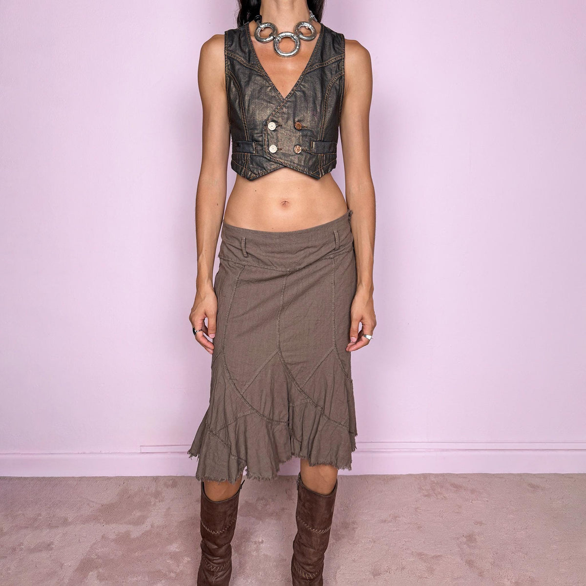 Vintage 2000s brown midi skirt, made in Italy from a structured 95% cotton and 5% elastane blend. Featuring exposed seam detailing, sculptural panel construction, and a flared asymmetric hem finished with raw, frayed edges. Side zip closure. Non-stretch. The earthy, deconstructed construction gives it a rustic, avant-garde aesthetic. Can be worn high-waisted for size M or mid- to lower-rise for sizes S and XS. Excellent vintage condition.