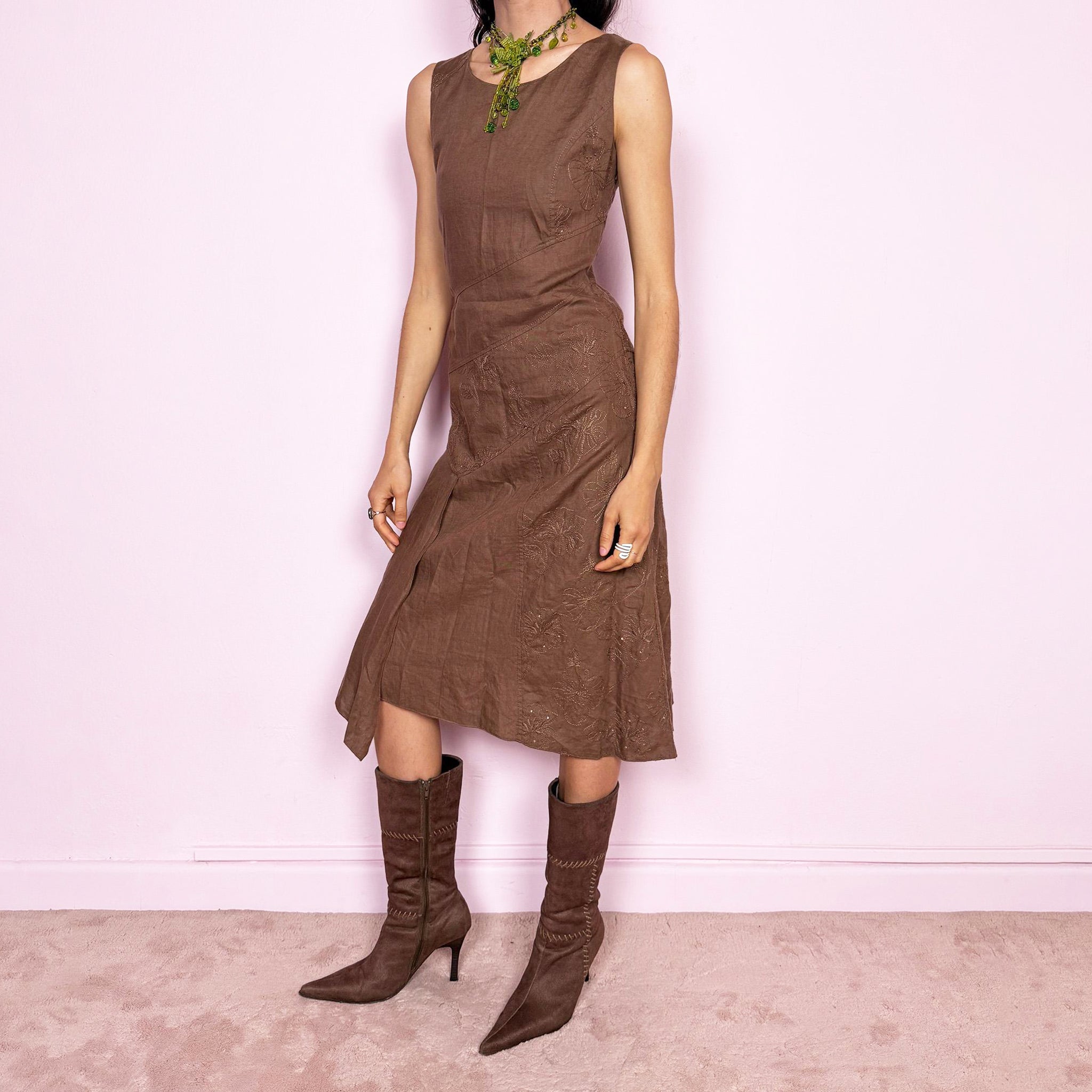 Vintage 2000s brown sleeveless midi dress with a deconstructed paneled and layered design. Features floral embroidered details, asymmetric draping, and a side zip closure with a non-stretch fit. Perfect for summer fairy styling or avant-garde everyday looks. The composition label is missing, so the exact fabric is unknown, though it feels like linen or ramie. From a French brand. Great vintage condition.