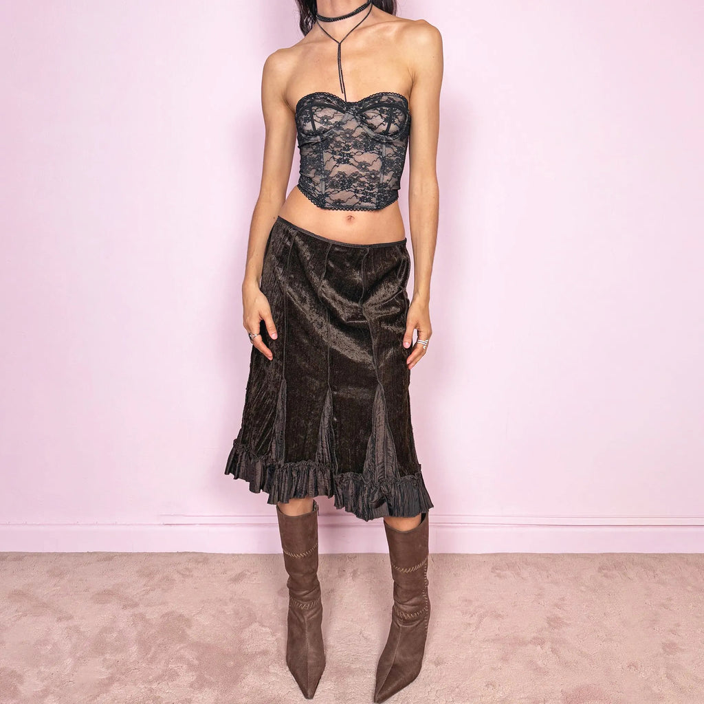 Vintage 90s dark brown velvet midi skirt with a whimsical fairycore feel. Features soft godet inserts creating a flared silhouette and a ruffle hem for movement. Back zip closure with slight stretch. Can be worn high waisted for size L or low rise for size M. Perfect for autumn winter avant garde styling. Great vintage condition.