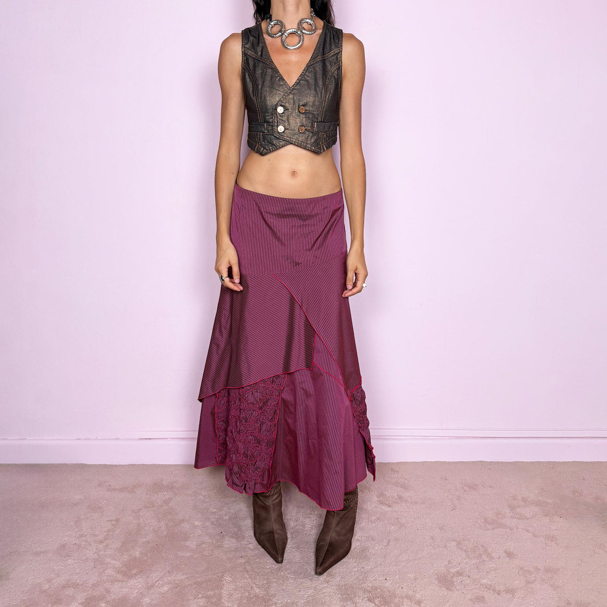 Vintage 2000s burgundy asymmetric maxi skirt featuring a side zip closure and an irregular layered construction combining fine pinstripe panels with ruched and gathered textured sections. Can be worn high-waisted for size L or lower on the waist for sizes M–S. From a French brand, made from 100% non-stretch polyester. Excellent vintage condition.