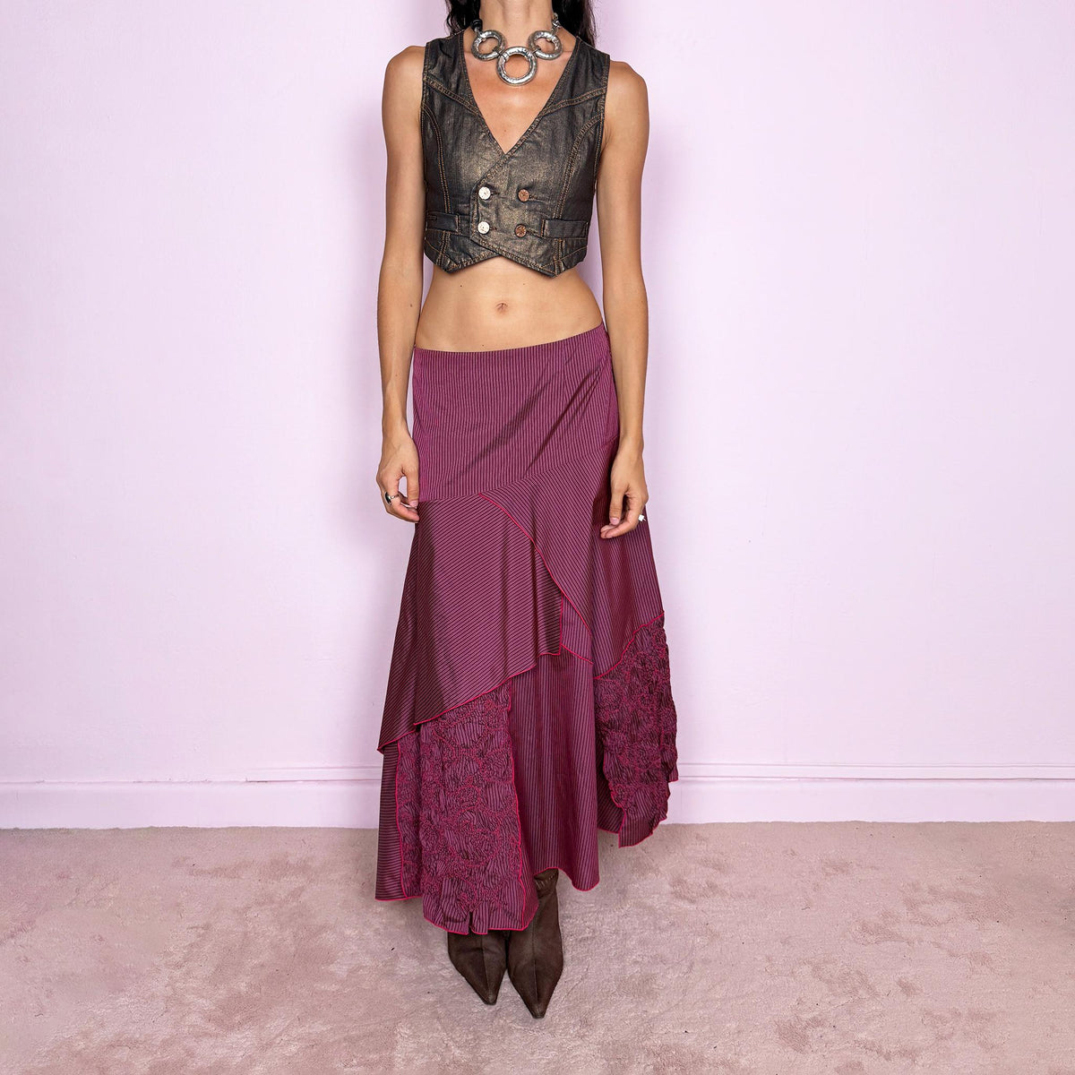 Vintage 2000s burgundy asymmetric maxi skirt featuring a side zip closure and an irregular layered construction combining fine pinstripe panels with ruched and gathered textured sections. Can be worn high-waisted for size L or lower on the waist for sizes M–S. From a French brand, made from 100% non-stretch polyester. Excellent vintage condition.