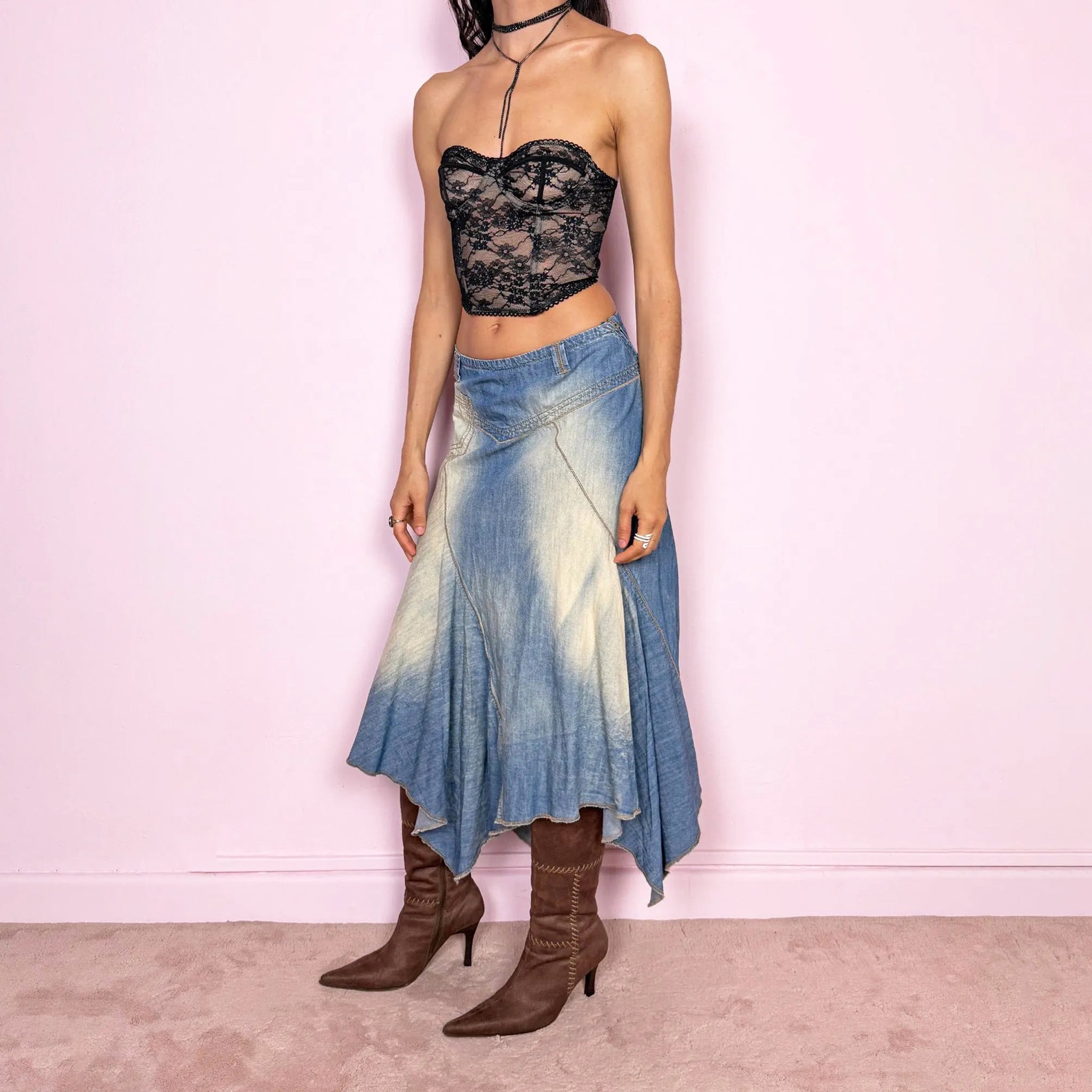 Vintage 2000s blue denim midi skirt with an avant garde flared asymmetric silhouette and panelled construction. Features a soft faded wash, raw hem detailing, and side zip closure, no stretch. Unique bold design perfect for summer festival styling. Can be worn high-waisted for size M or mid- to lower-rise for sizes S–XS. Great vintage condition.