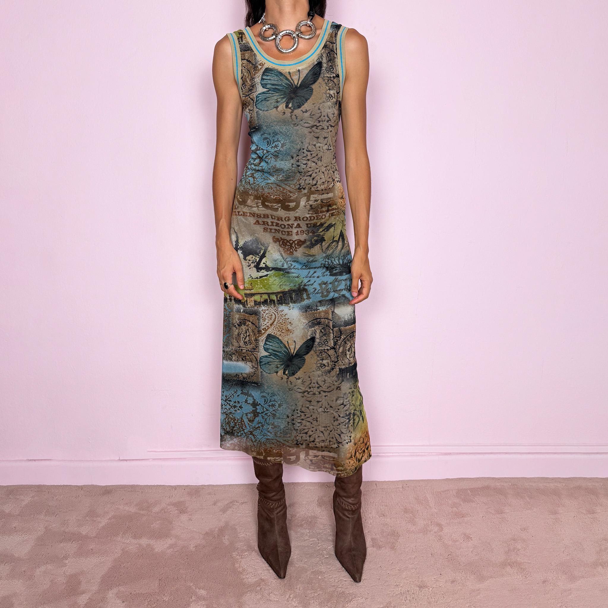 Vintage 2000s fitted sleeveless midi dress in lightweight stretch mesh with matching mesh lining for a softly sheer layered effect. Features blue, green and brown butterfly graphics, faded architectural motifs, postcard-style typography and contrast trim, with a visual Y2K art-to-wear feel for maximalist editorial styling. Made in France by a French brand. Excellent vintage condition.