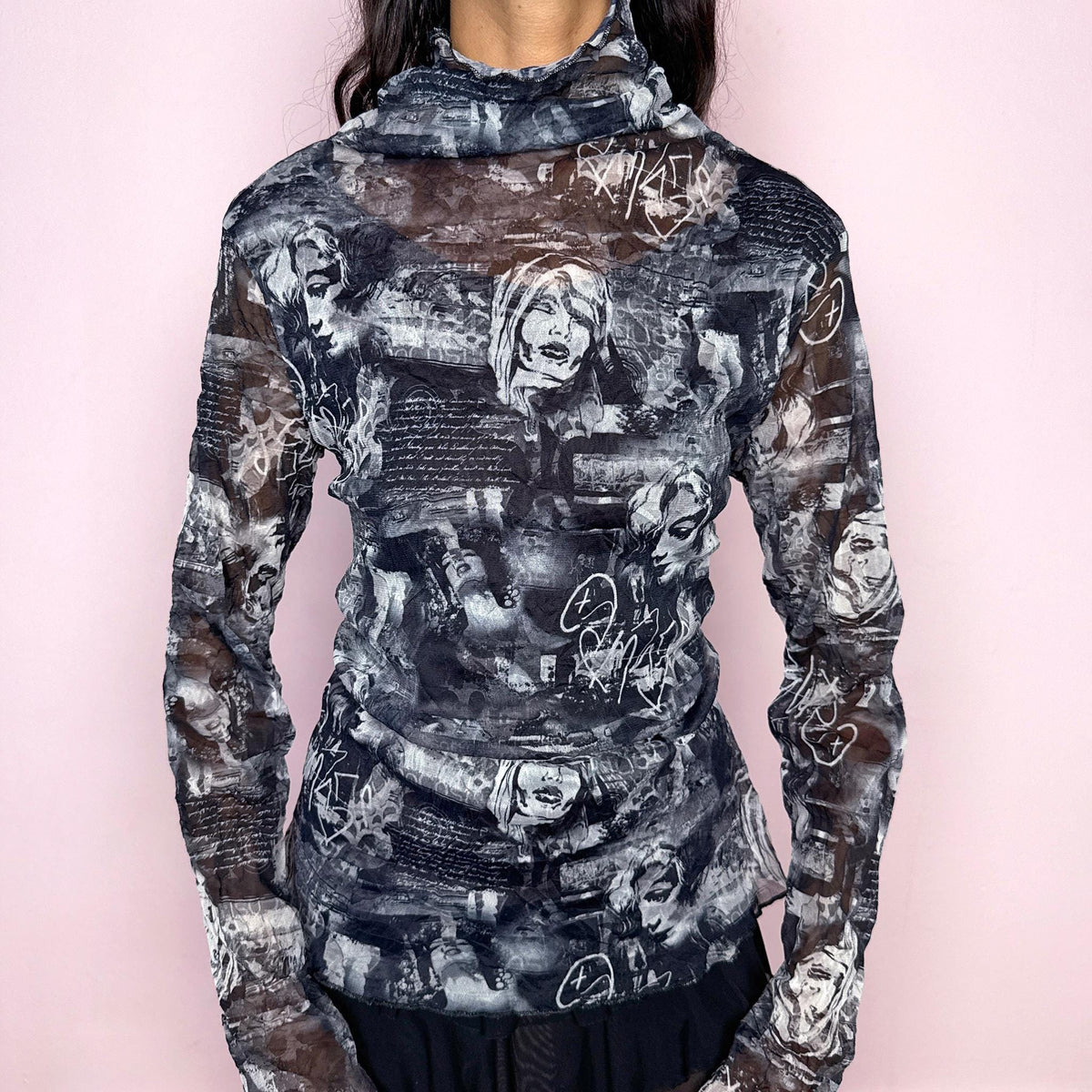Vintage 2000s dark navy blue, gray and white semi-sheer long-sleeve mesh top with a fitted silhouette and soft rolled high neck. Features an all-over monochrome collage print with illustrated female faces, graffiti-style graphics and layered text. For dark avant-garde styling. From a French brand, made in France from stretchy polyester. Excellent vintage condition.