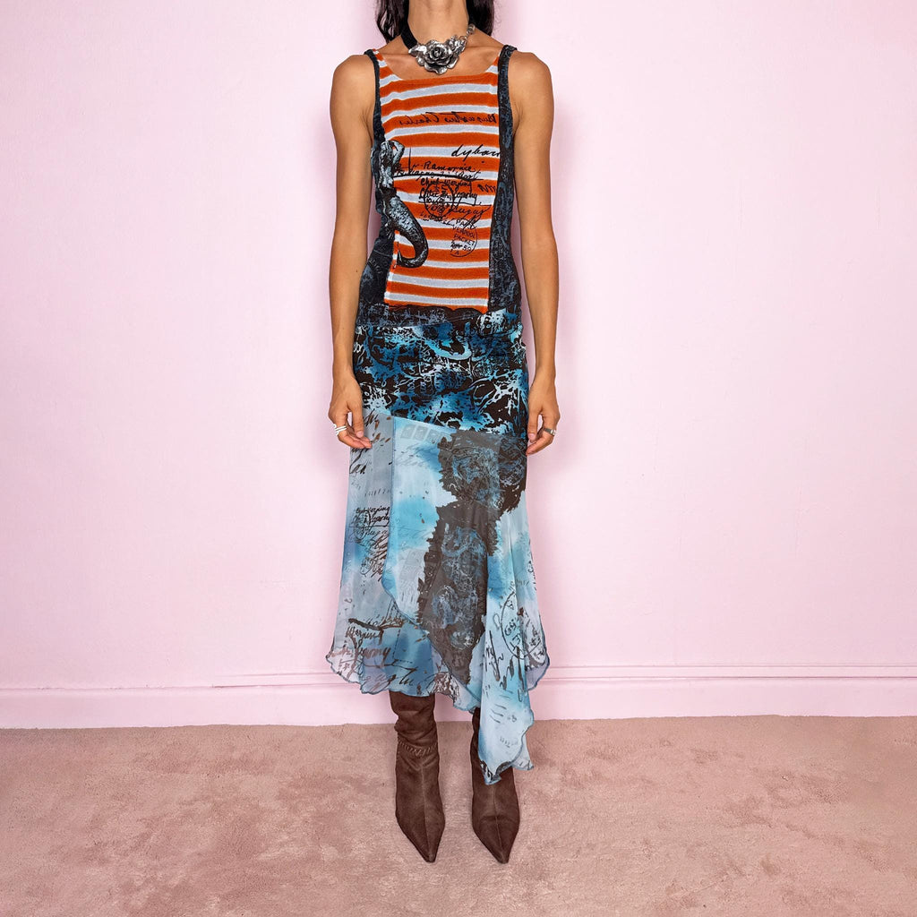 Vintage 2000s maximalist maxi dress featuring a mixed construction that combines fitted printed mesh through the upper body with semi-sheer mesh panels through the lower section, creating a fluid, layered effect. The graphic composition mixes striped, abstract, and handwritten-style motifs in burnt orange, brown, and vivid blue tones, finished with a dramatic asymmetric handkerchief hem for extra movement. A bold Y2K art-to-wear piece with an avant-garde, editorial feel.