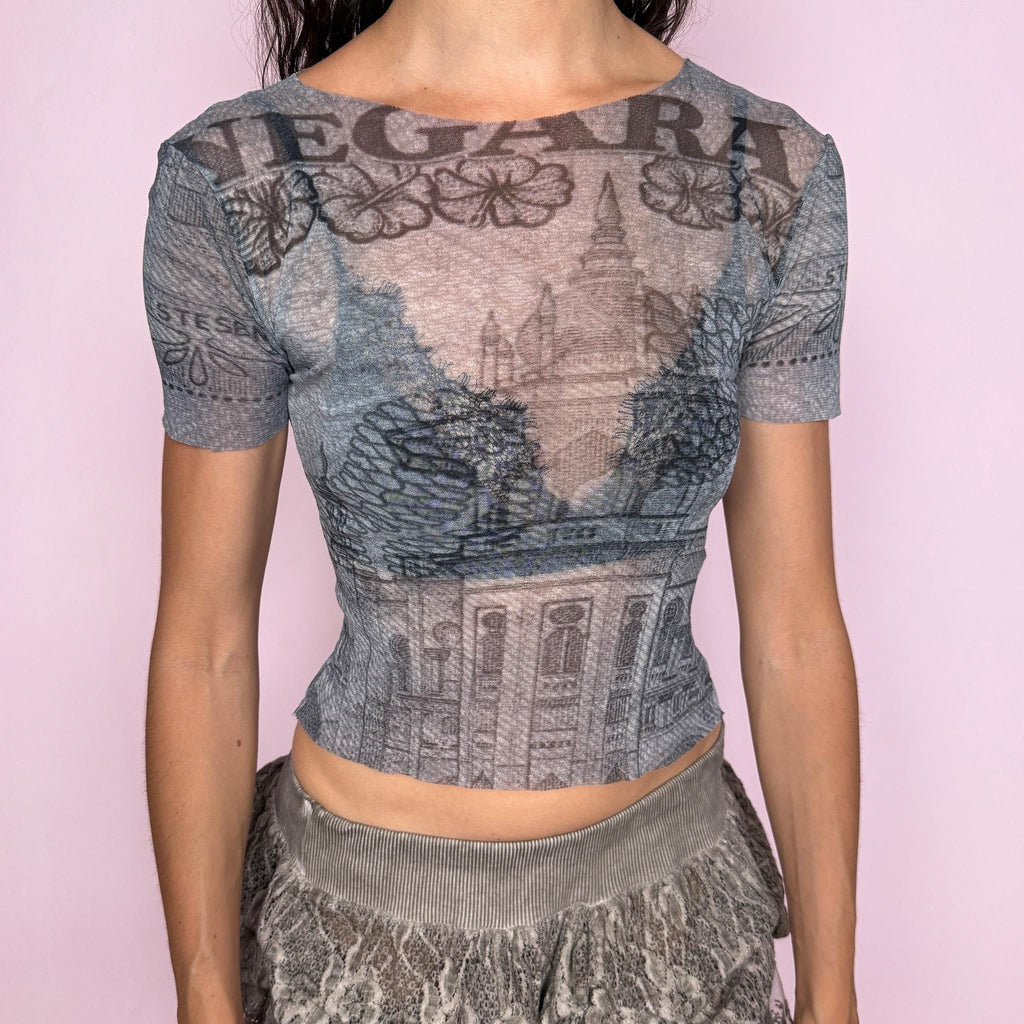 Vintage 2000s semi-sheer mesh top in soft grey tones with an architectural graphic print, fitted second-skin silhouette, short sleeves, wide neckline, and raw-edge finish. Lightweight, stretchy, slightly transparent, and futuristic with a deconstructed Y2K look. By Italian brand Gazebo, fabric composition unknown due to missing label. Excellent vintage condition.