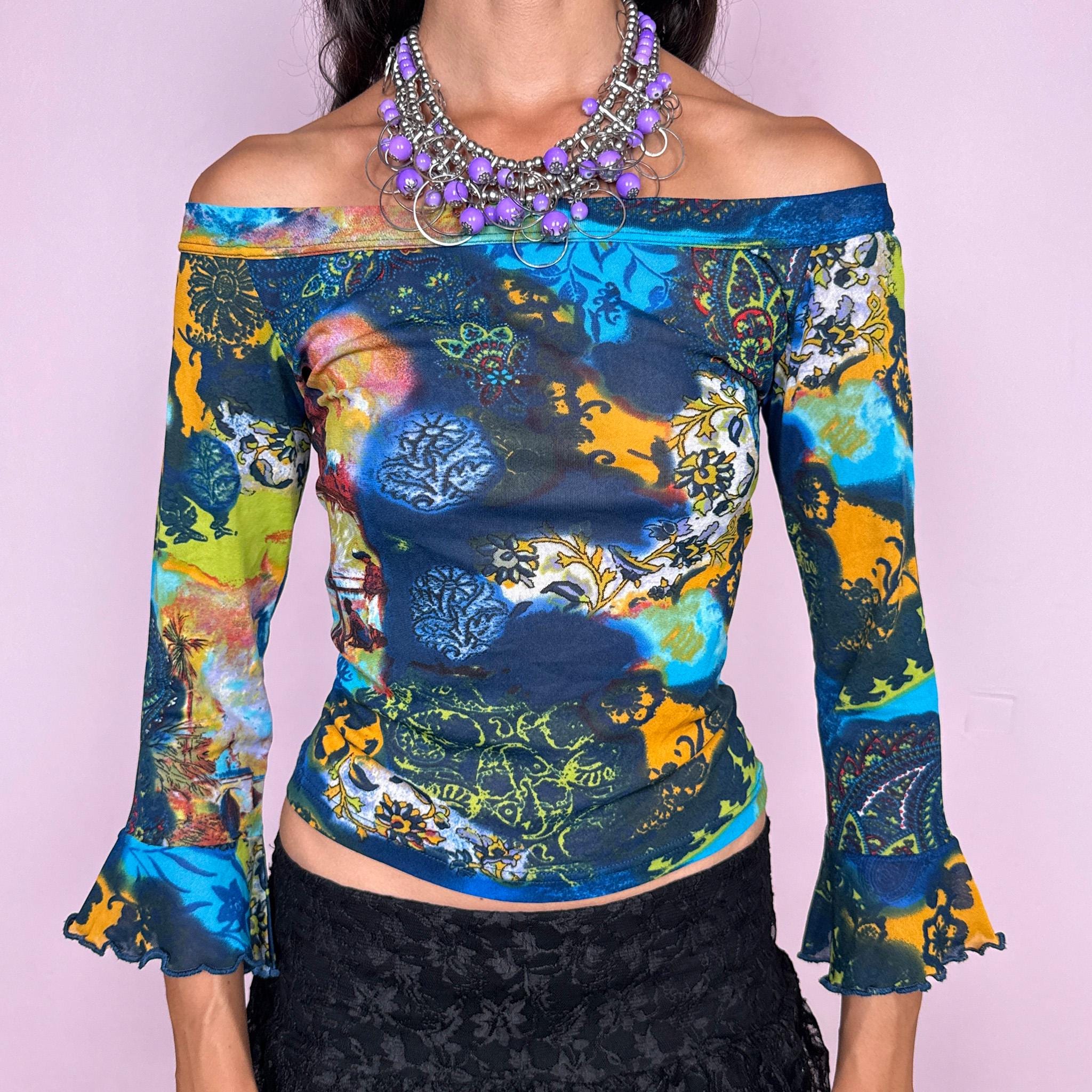 Vintage 2000s off-shoulder mesh top featuring a fitted, semi-sheer silhouette with a wide bateau neckline and flared three-quarter sleeves. Finished in a vivid mixed graphic print combining deep blue, turquoise, lime, yellow, and ornamental motifs for a maximalist bohemian Y2K look. Made in Italy by an Italian brand from 66% polyester and 34% polyamide. Excellent vintage condition.
