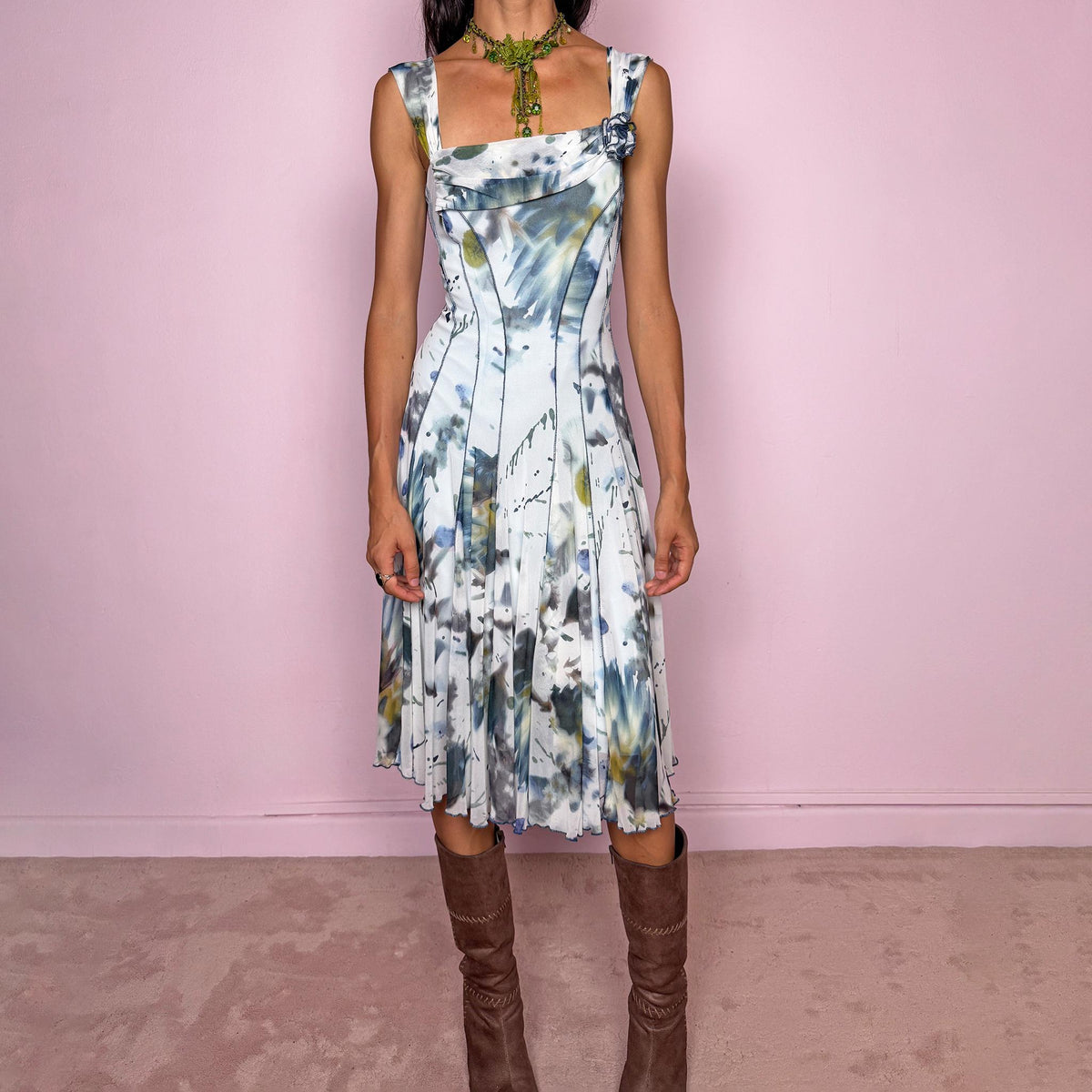 Vintage 2000s art-print midi dress featuring an abstract painterly graphic print in soft blue, gray, olive, and white tones, with a fitted bodice, square neckline, wide shoulder straps, and sculpted panel seams that open into a fluid flared skirt. Finished with a small rosette appliqué at the neckline. A distinctive Y2K art-to-wear piece. Made in the USA by an American brand from stretchy 100% polyamide mesh. Excellent vintage condition.