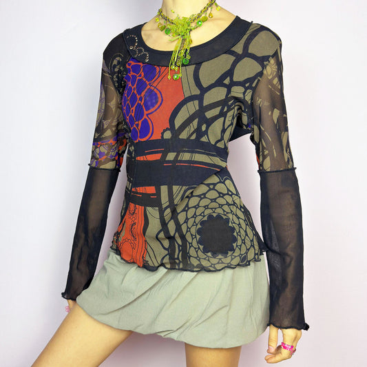 The Y2K Abstract Printed Mesh Top is a vintage 2000s sheer long-sleeve top featuring a bold abstract print in earthy tones with pops of red and blue. Designed with contrast black mesh sleeves, this artistic piece is perfect for edgy streetwear, cyberpunk, or grunge-inspired outfits. Ideal for layering or wearing solo for a statement look.