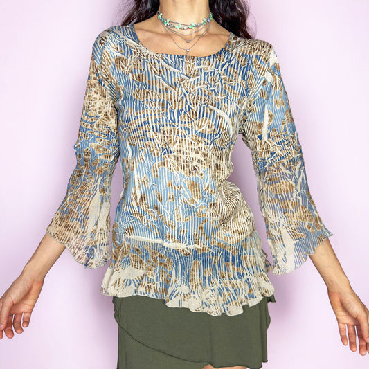 The vintage 2000s bell sleeve top is made in France with a crinkled textured finish. It features an abstract print in soft beige, slate blue, and brown, with a scoop neckline, three-quarter flared sleeves, and a ruffled hem. This blouse blends romantic texture with airy movement—an effortlessly elegant piece for formal avant garde events or earthy, whimsical styling. Made of polyester-spandex blend. Excellent vintage condition.