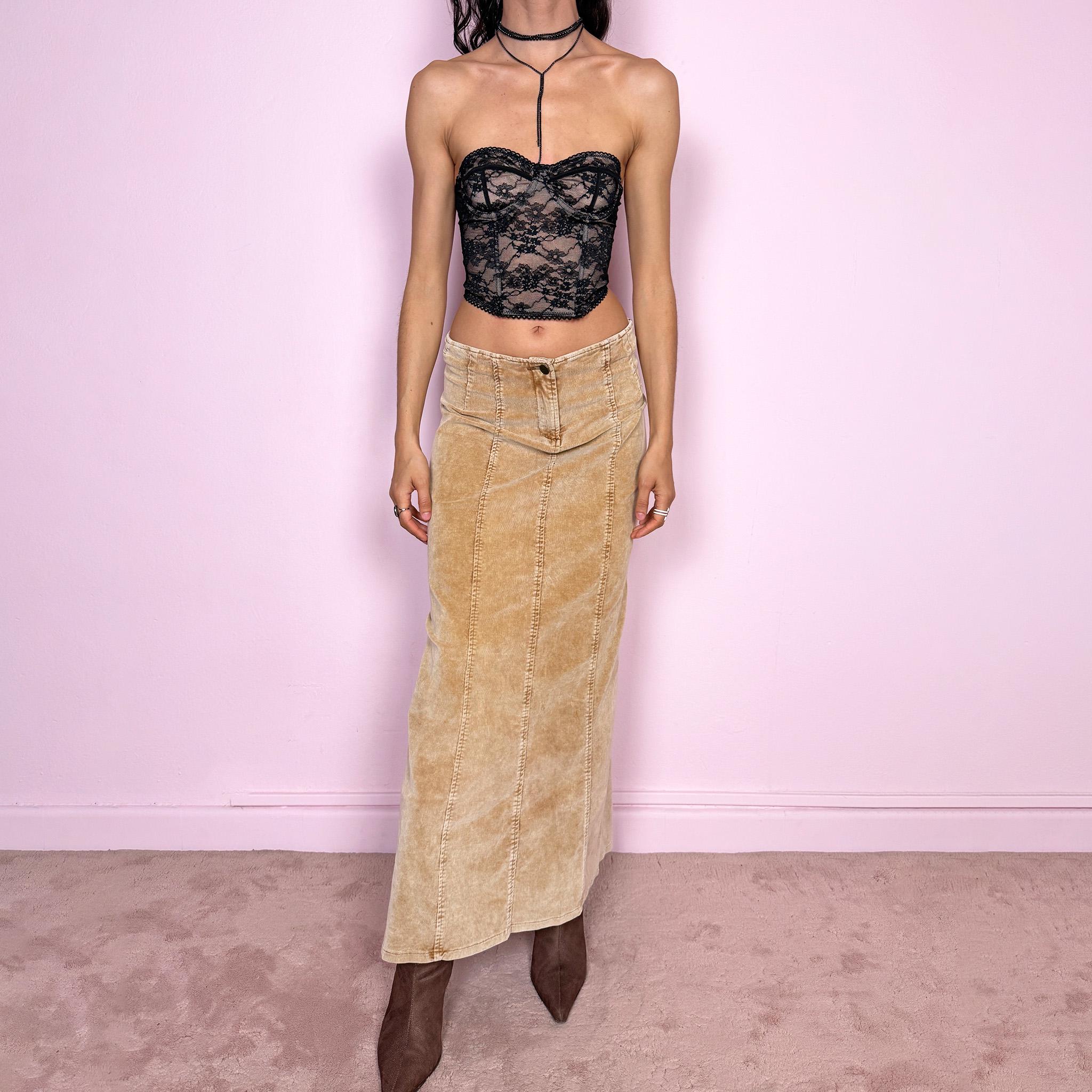 Vintage 2000s beige corduroy maxi skirt with a soft ribbed texture and indie grunge feel. Features a stretchy fitted silhouette with panelled seams and a front zip closure. Perfect for autumn winter layering. Can be worn mid to low rise for size XXS/XS. Excellent vintage condition.