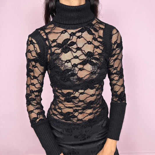 Vintage 2000s black fitted lace mesh long sleeve top with a sheer floral pattern and subtle shiny thread details. Features a soft mohair ribbed knit turtleneck and matching cuffs, contrasting the delicate mesh body. Perfect for party nights and bold layering looks. Lace is polyester. Made in France by a French brand. Excellent vintage condition.