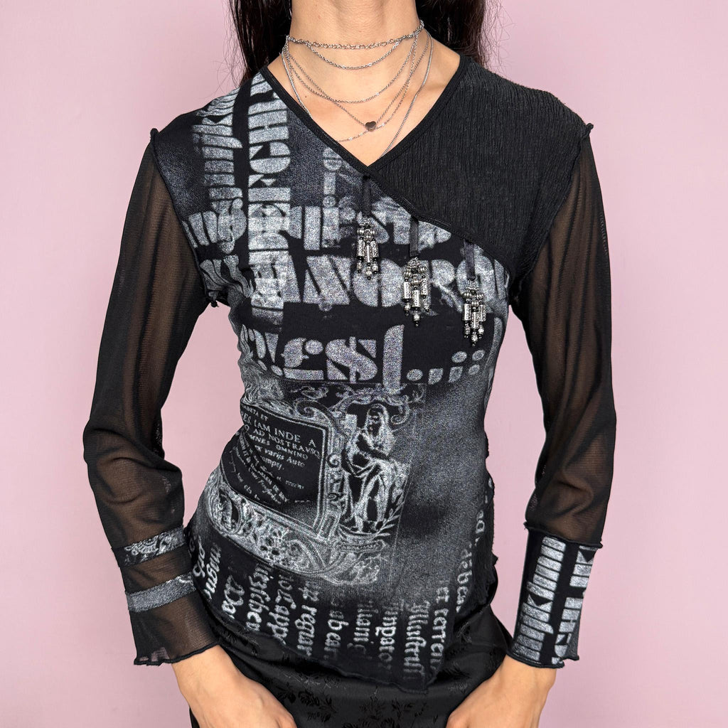 Vintage 2000s black stretchy top with semi sheer mesh long sleeves and beaded details. Features an avant garde deconstructed design with asymmetric layered panels, mixed textures, and bold graphic print throughout. Made in France. Excellent vintage condition.