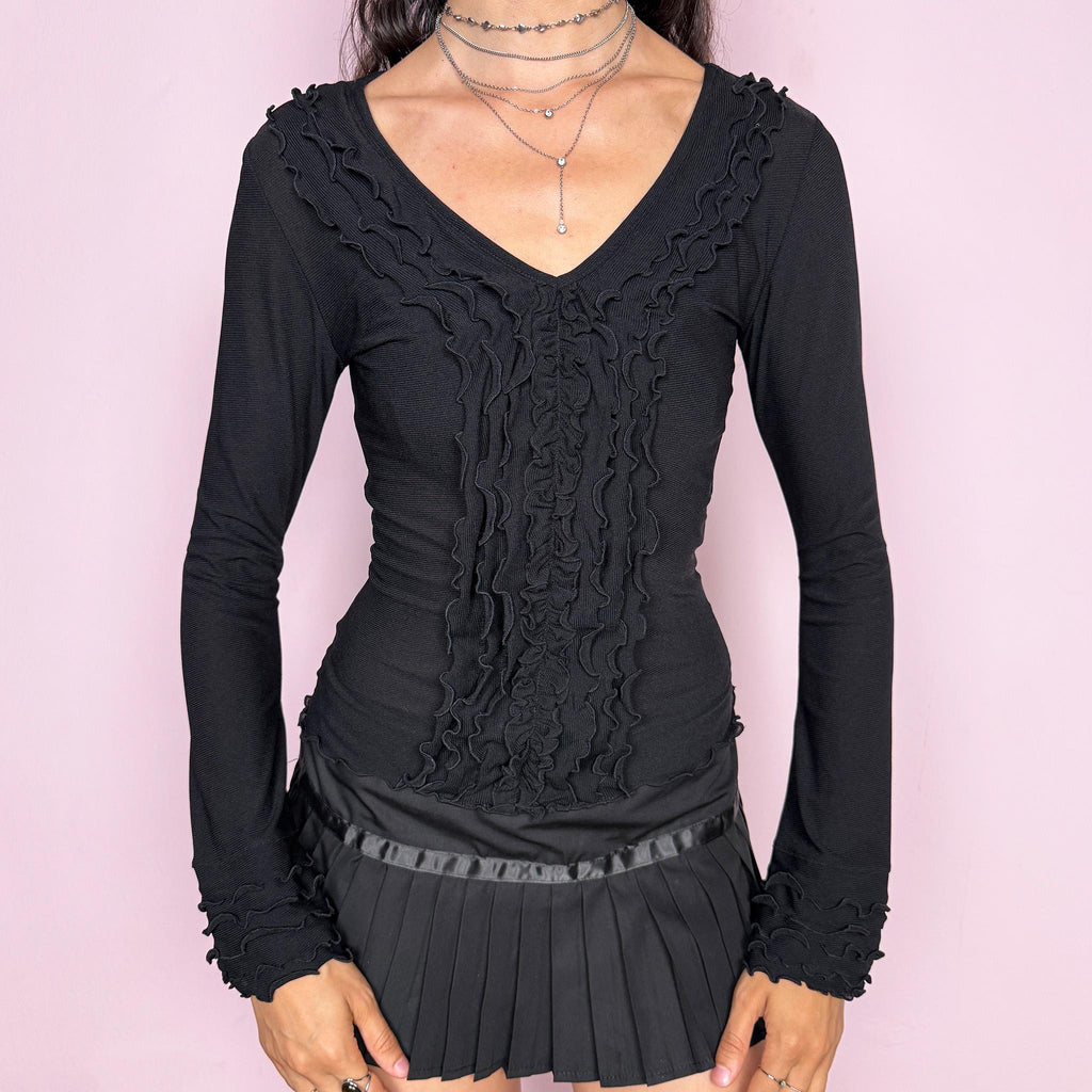 Vintage 2000s black mesh long sleeve top with a super flattering fitted stretchy silhouette. Features a V neckline with cascading ruffle panel details, ruffled cuffs, and delicate sheer texture for an elegant Victorian-inspired look. Perfect for night or evening styling with a minimal avant-garde edge. Made from nylon. Excellent vintage condition.
