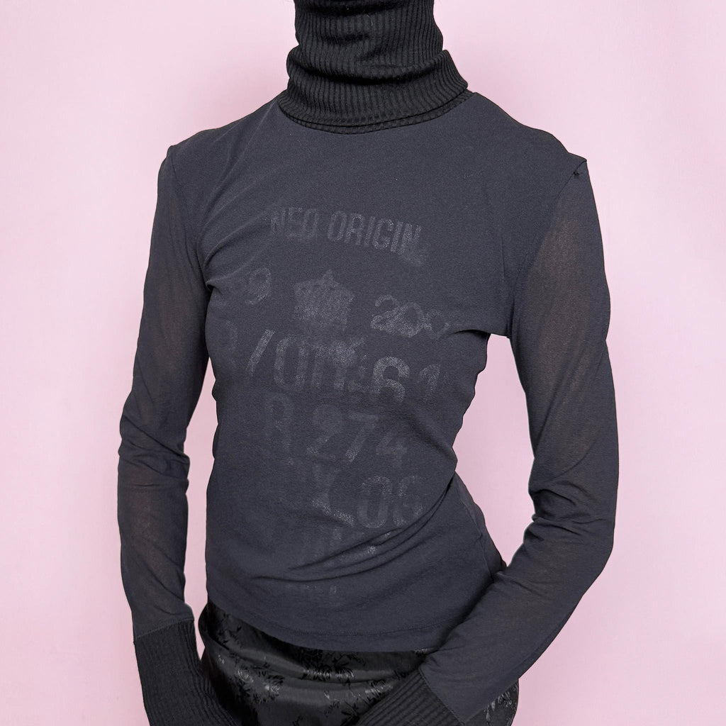 Vintage 2000s black mesh sheer long sleeve top with a ribbed knit turtleneck and ribbed cuffs, featuring a subtle text lettering print visible through the underlayer. Stretchy and fitted with a cyber-futuristic and minimalist feel, ideal for streetwear, grunge outfits, and autumn layering. Made from a polyester wool polyamide blend. Excellent vintage condition.