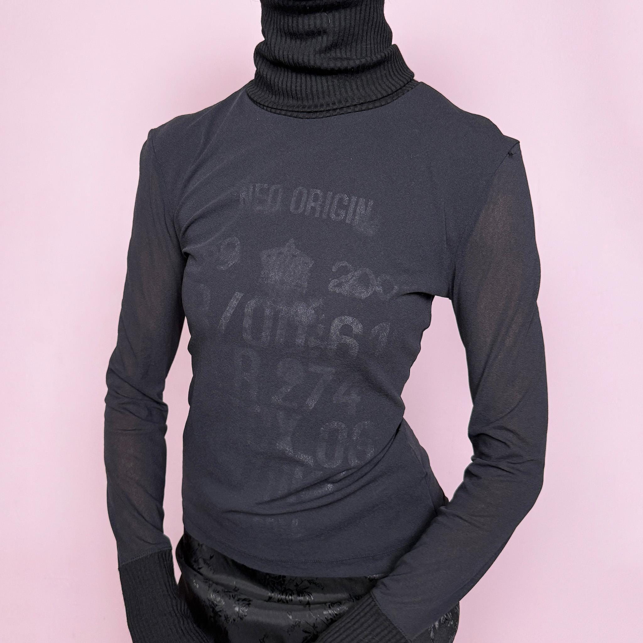 Vintage 2000s black mesh sheer long sleeve top with a ribbed knit turtleneck and ribbed cuffs, featuring a subtle text lettering print visible through the underlayer. Stretchy and fitted with a cyber-futuristic and minimalist feel, ideal for streetwear, grunge outfits, and autumn layering. Made from a polyester wool polyamide blend. Excellent vintage condition.