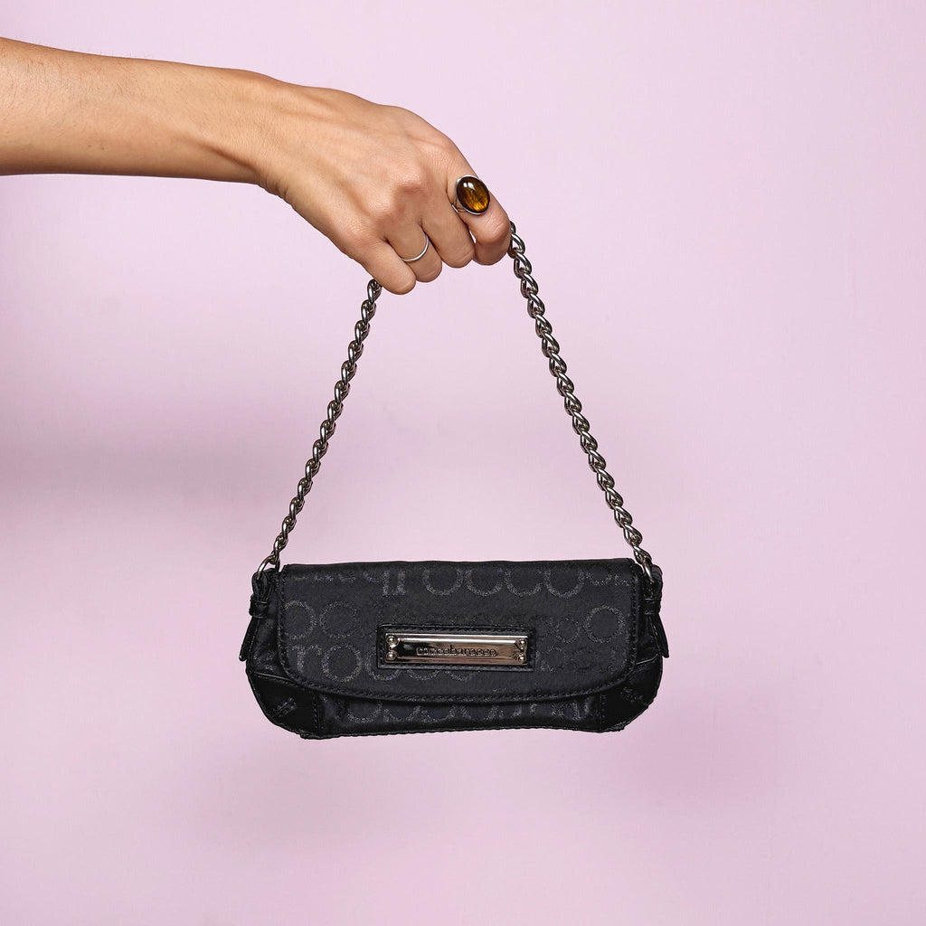 Vintage Y2K black mini baguette bag with shiny monogram finish, snap button closure, and chain shoulder strap. Iconic 2000s Italian design by Roccobarroco, ideal for party nights, events, and elegant glam Y2K styling. Made from polyester. Excellent vintage condition.